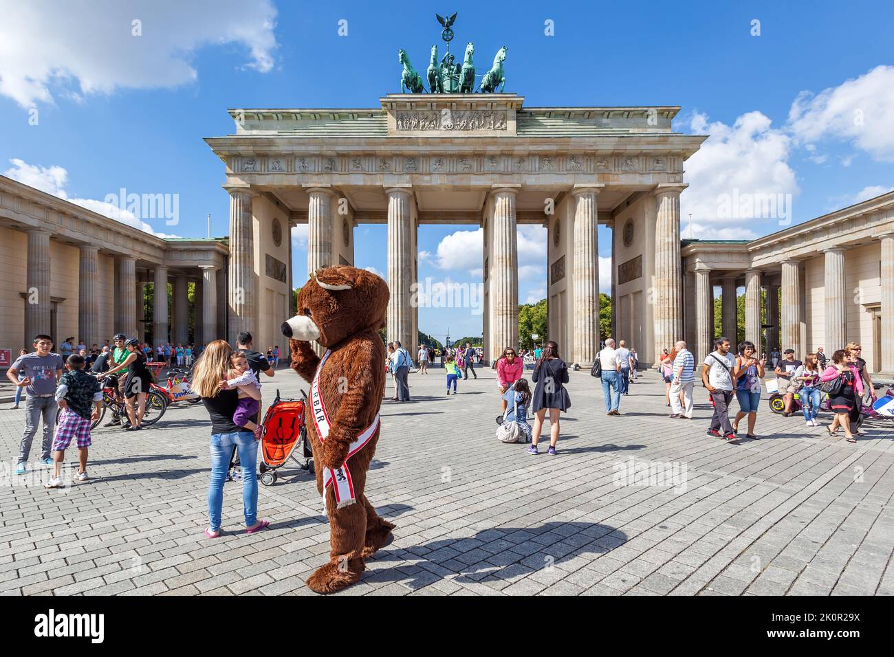 Berlin, Germany - August 23, 2012: Walking people by The Brandenburg gate in Berlin Stock Photo