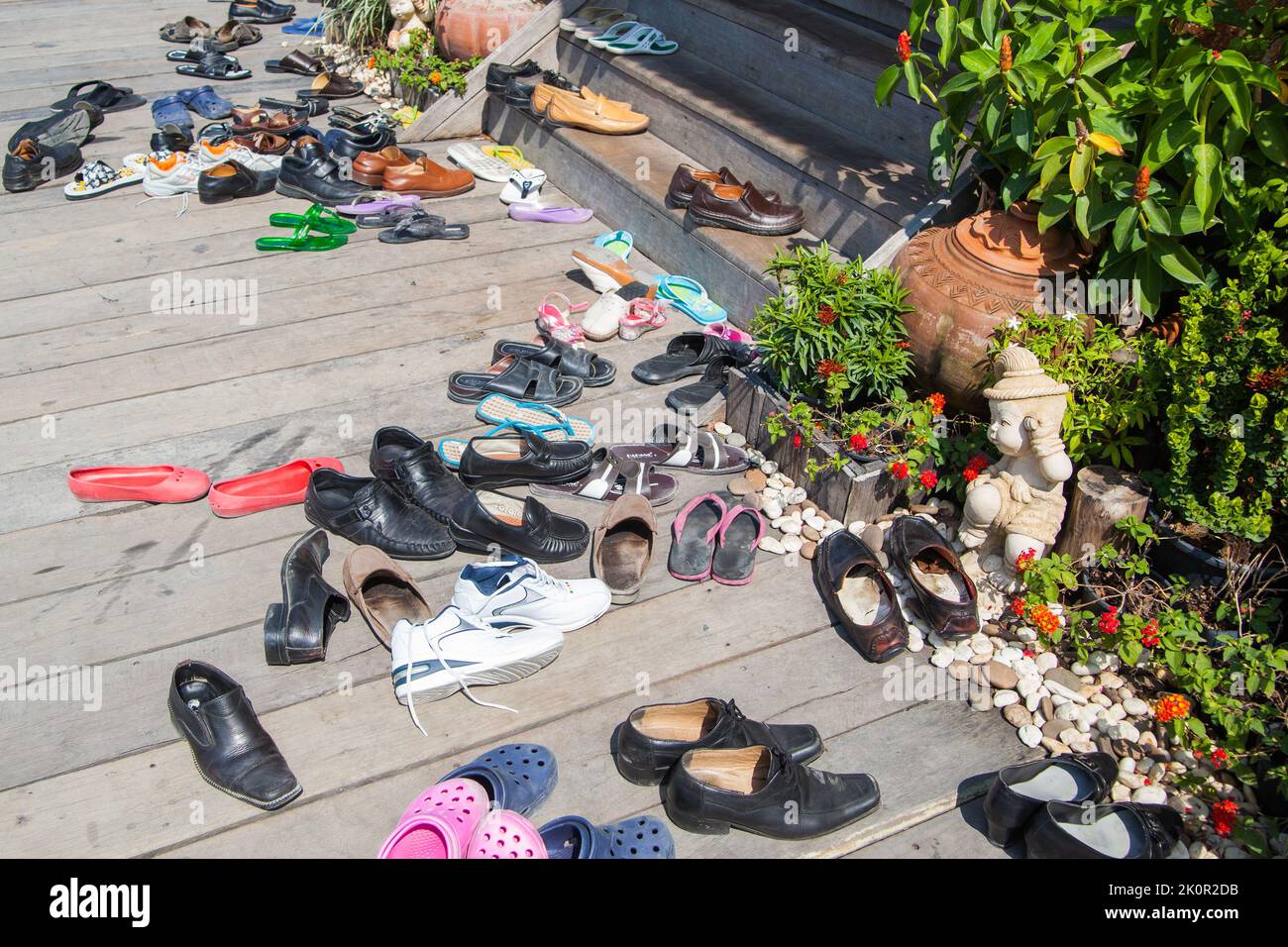Pattaya, Thailand - December 6, 2009: Taken off shoes by the entrance to buddhist temple in Thailand Stock Photo