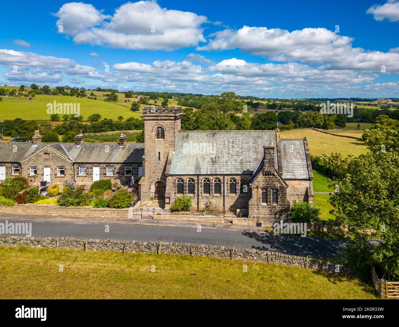 Aerial view of Church on a sunny day in North Yorkshire countryside. Felliscliffe Chapel of Ease beneath blue sky and scattered clouds. Stock Photo