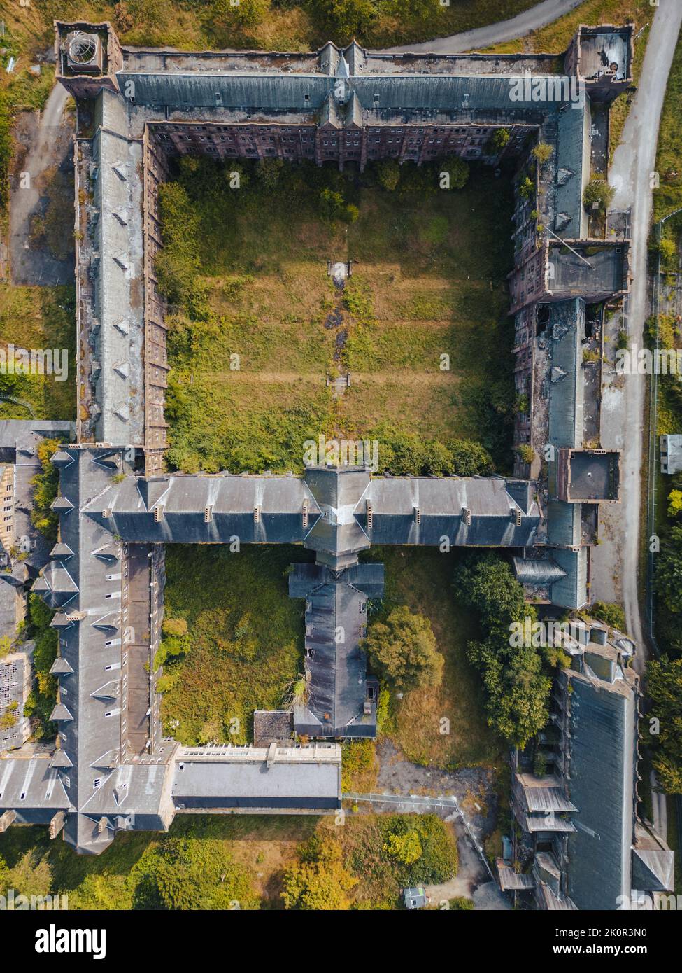 Aerial birds eye view of abandoned mansion house and boarding school. A former Catholic priest seminary, St Joseph's College and Seminary is a disued Stock Photo