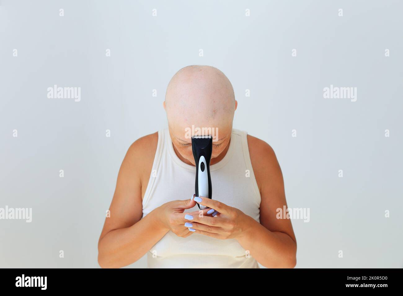 consequences of chemotherapy. Shaving off the last hair on the head