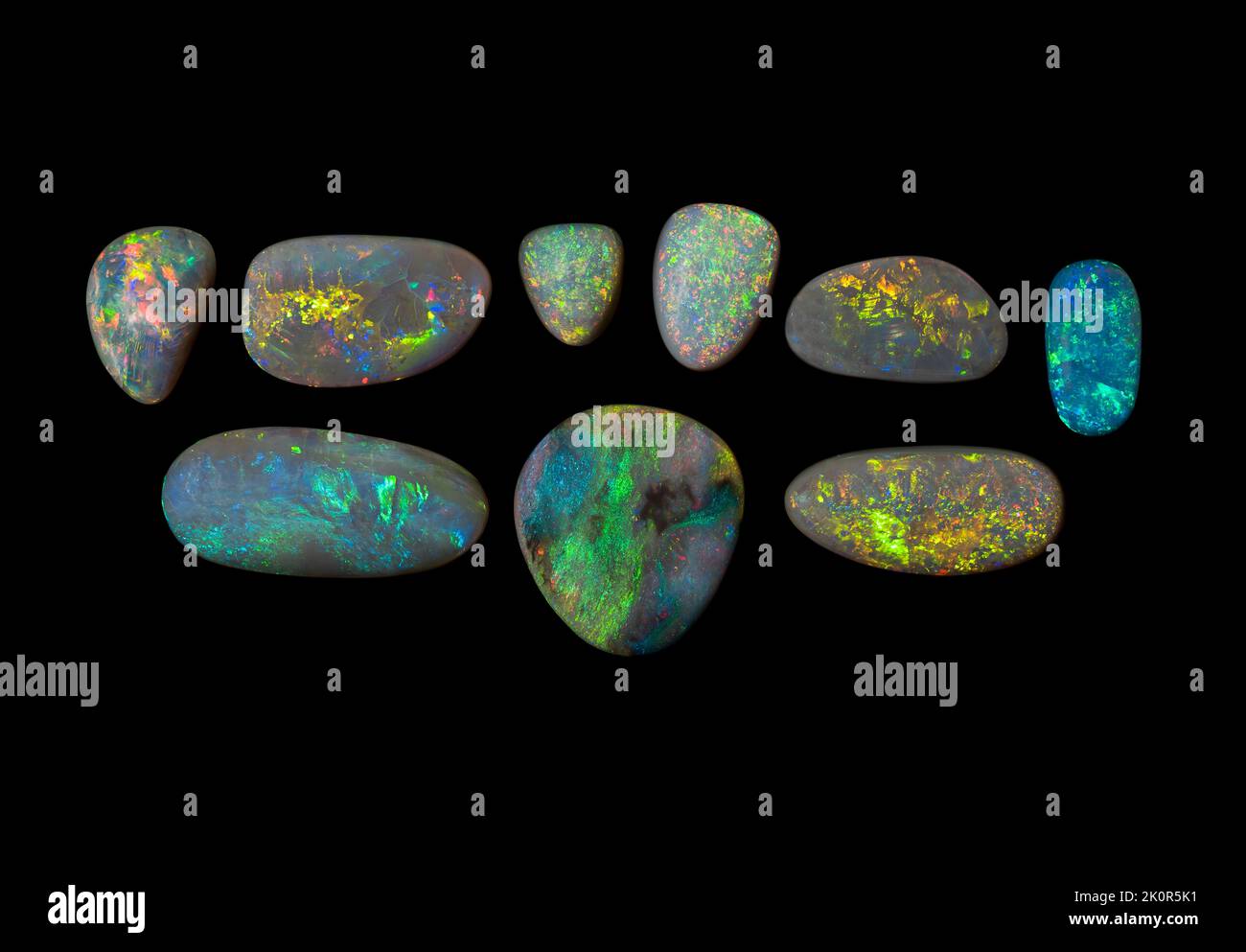Australian Opal gemstones, shot on a black background to highlight the