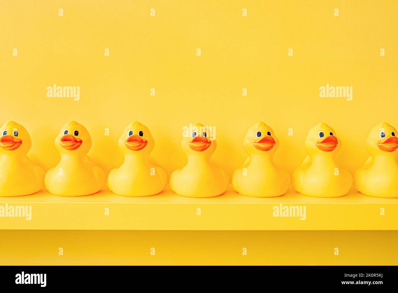 Yellow rubber duck in a line toy design yellow concept team work