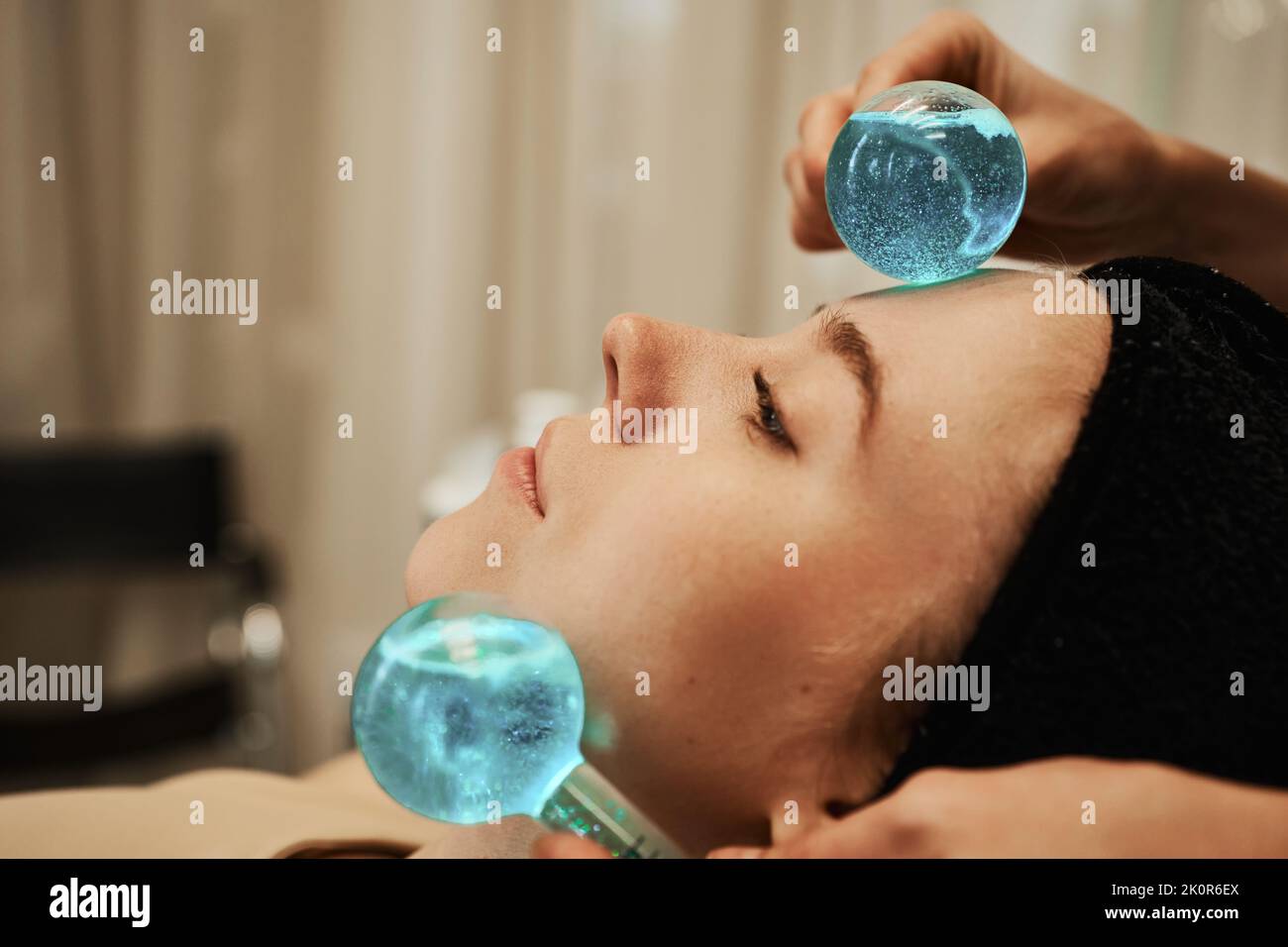 Facial massage with cold spheres Stock Photo Alamy