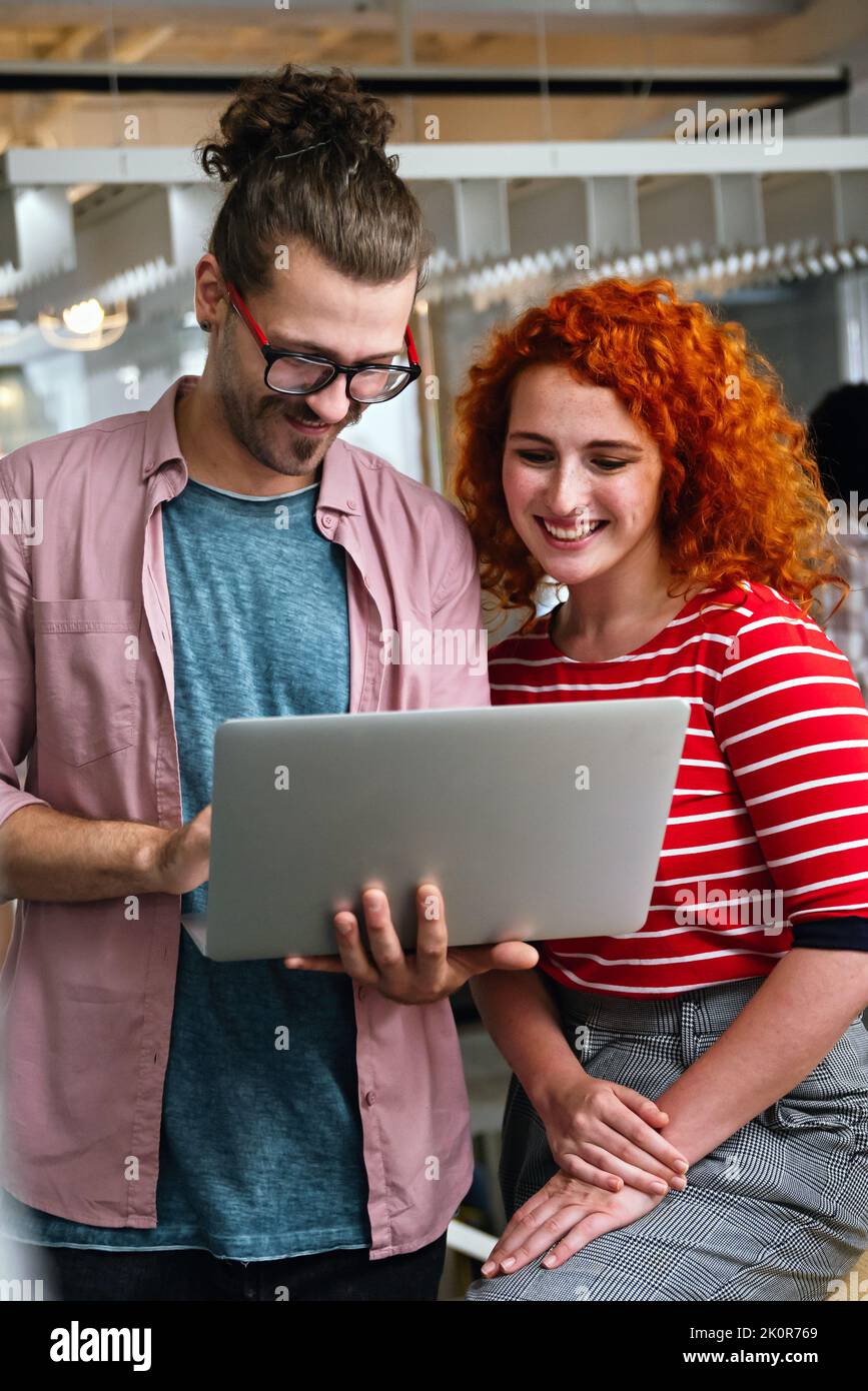 Programmers cooperating at IT company developing apps. People business work office concept Stock Photo