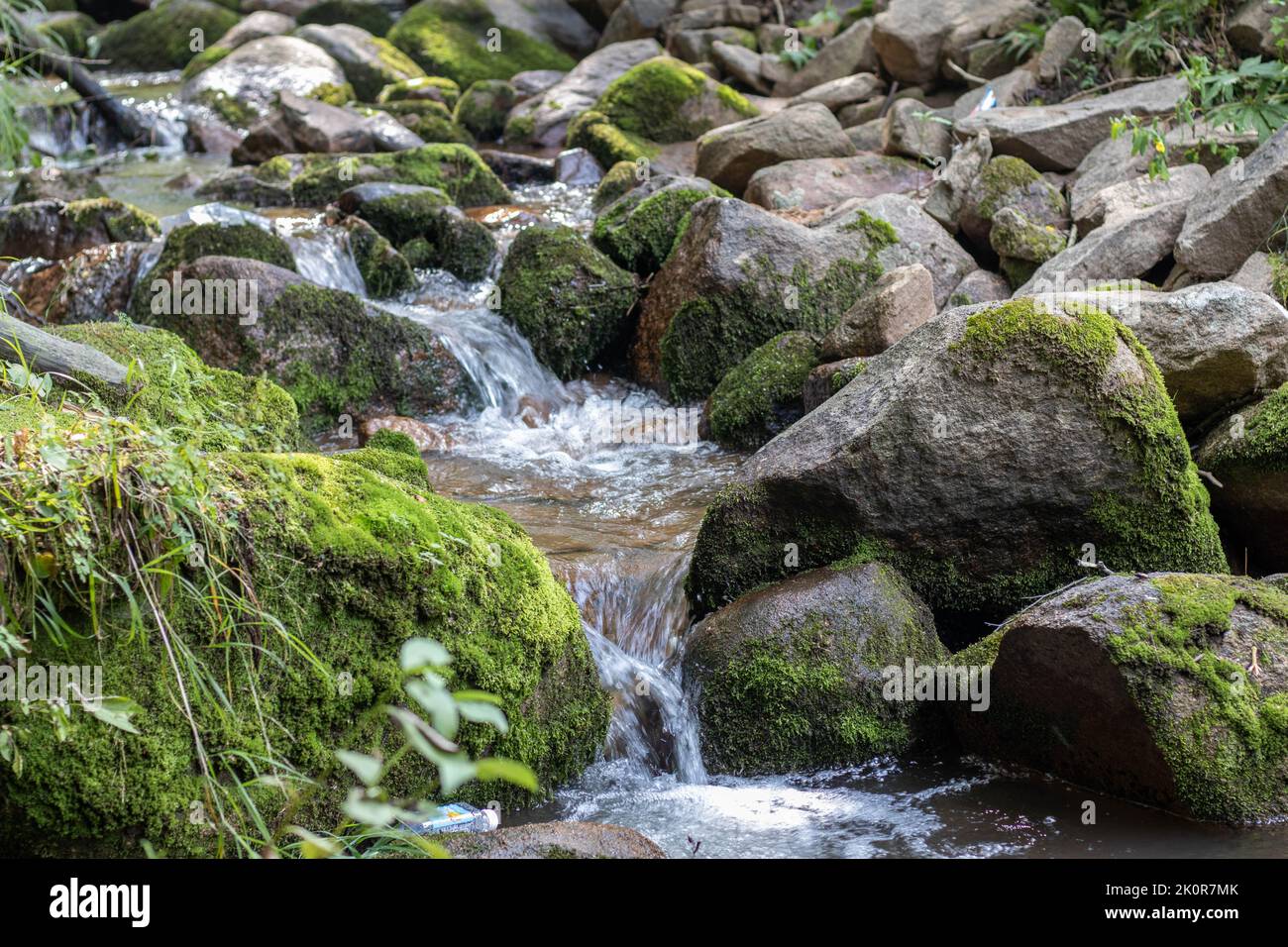 A landscape view of a rocky stream Stock Photo - Alamy
