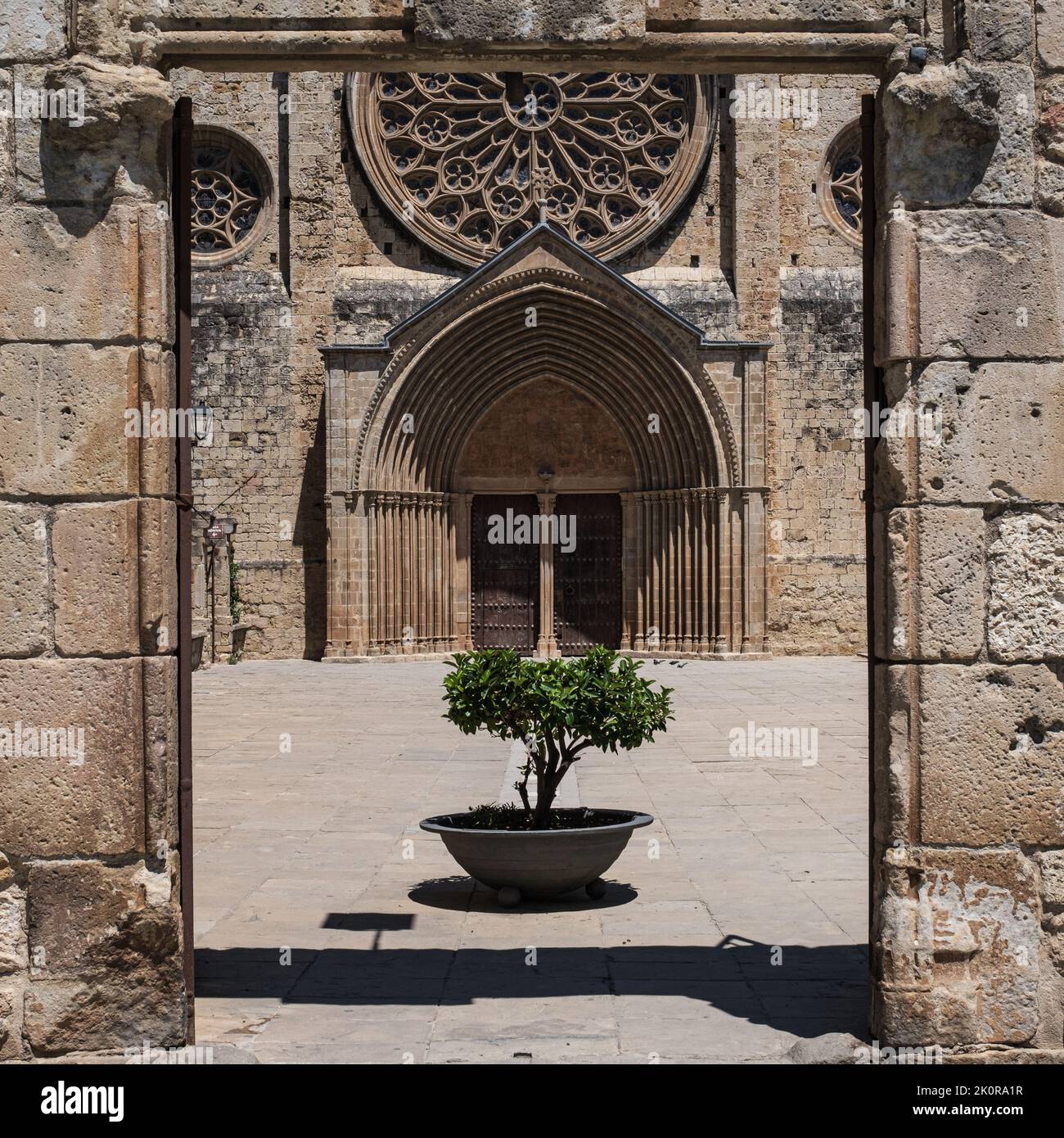 View of the main entrance to the Monastery of Sant Cugat del Vallès, an ancient Benedictine abbey that gives its name to this Catalan town. Stock Photo