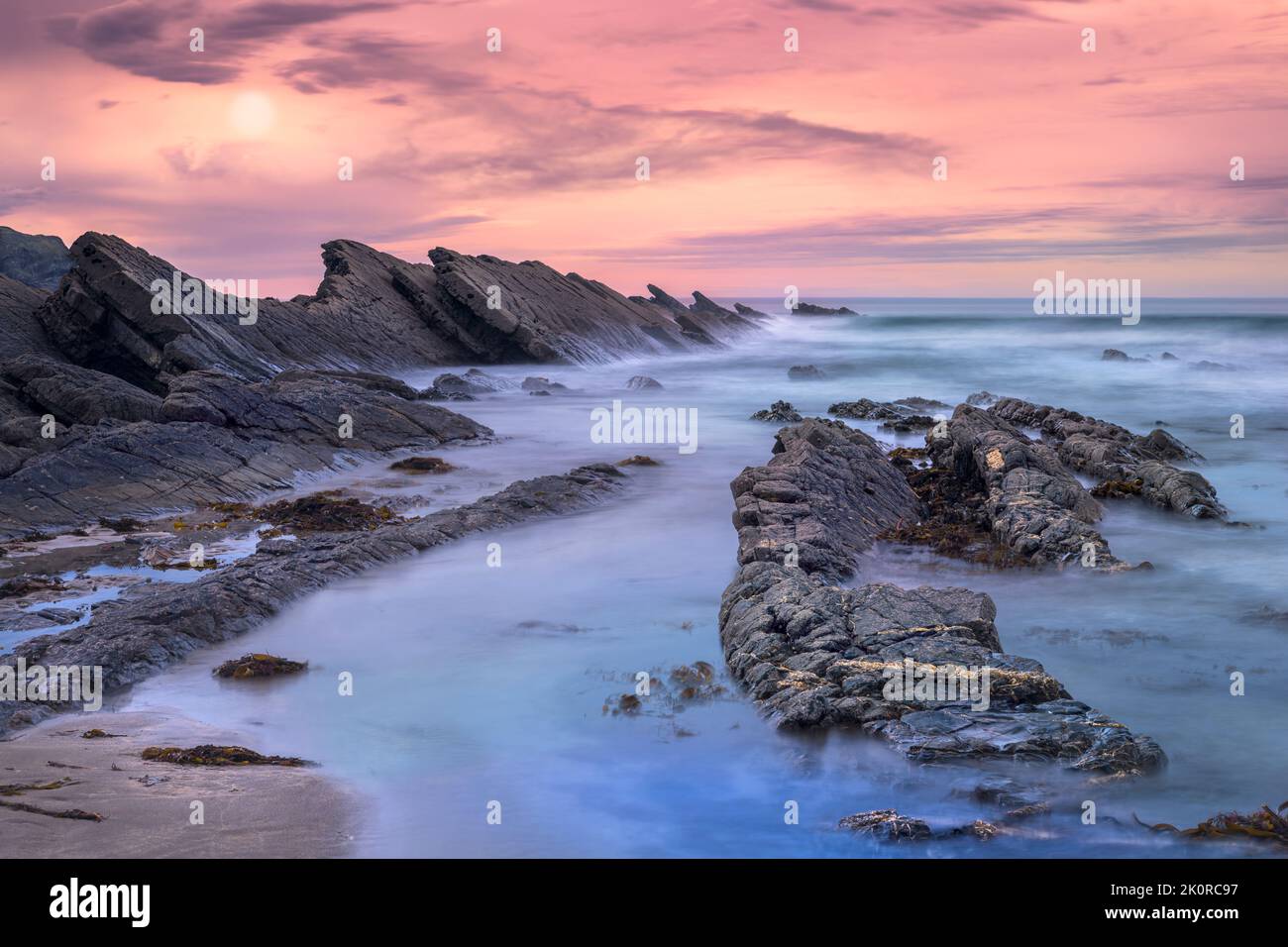 Situated on the Atlantic coast, the cove at Crackington Haven is surrounded by spectacular cliffs and has a geological phenomena named after it; The C Stock Photo