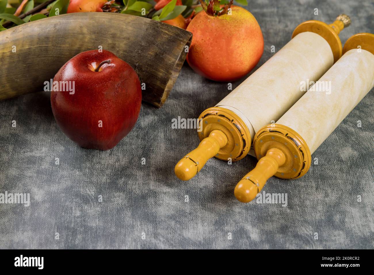 Kosher fruit, pomegranates, apples a honey jar that symbolizes the holiday Jewish New Year on Rosh Hashanah and shofar Stock Photo