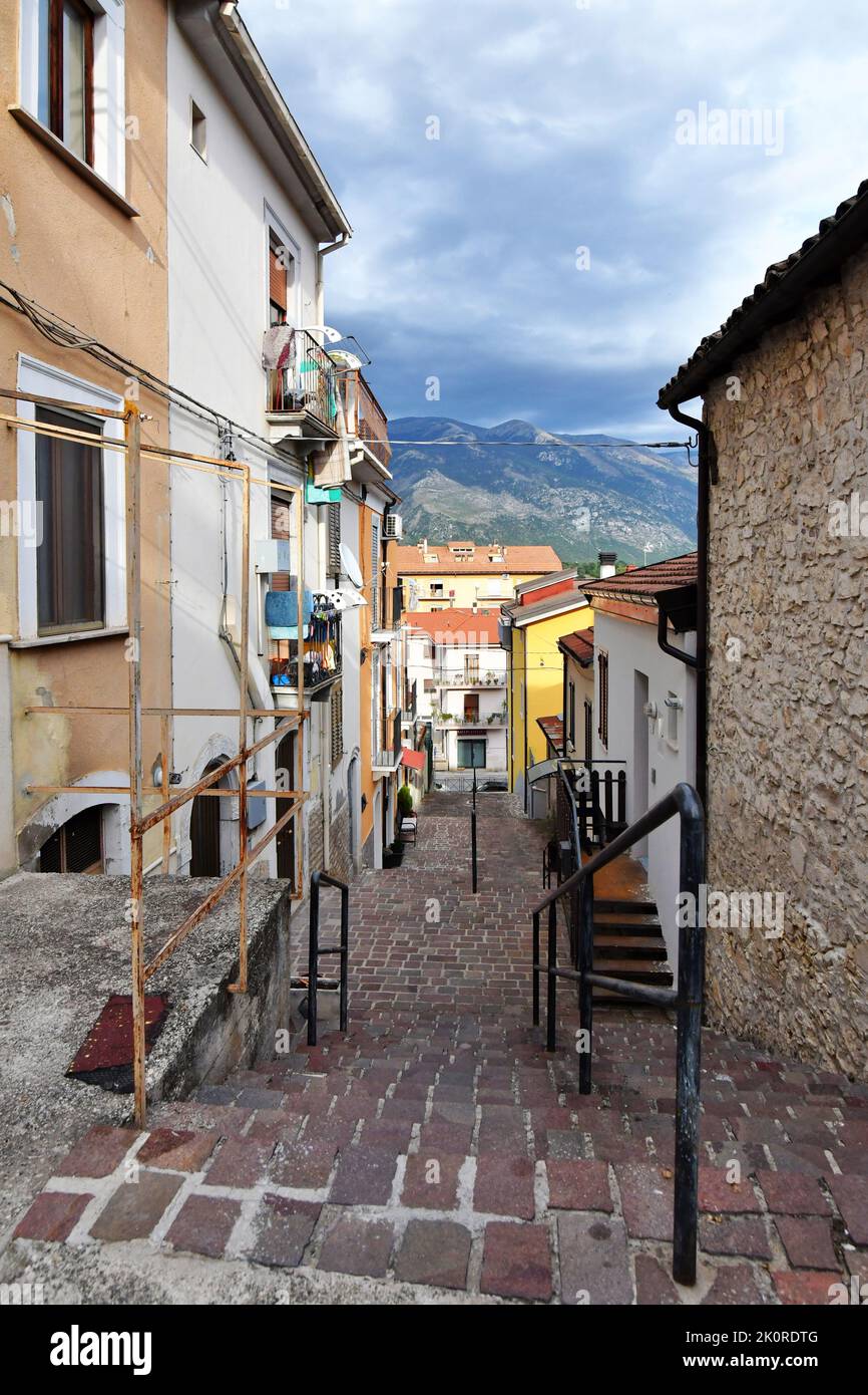 A narrow street between the old stone houses of Pratola Peligna, a
