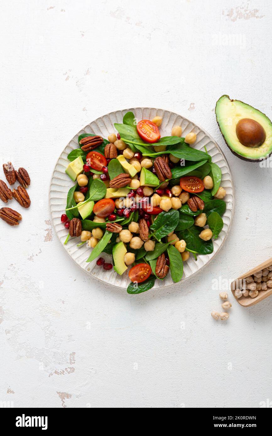 Overhead view of healthy food vegan avocado salad with greens and chick pea Stock Photo
