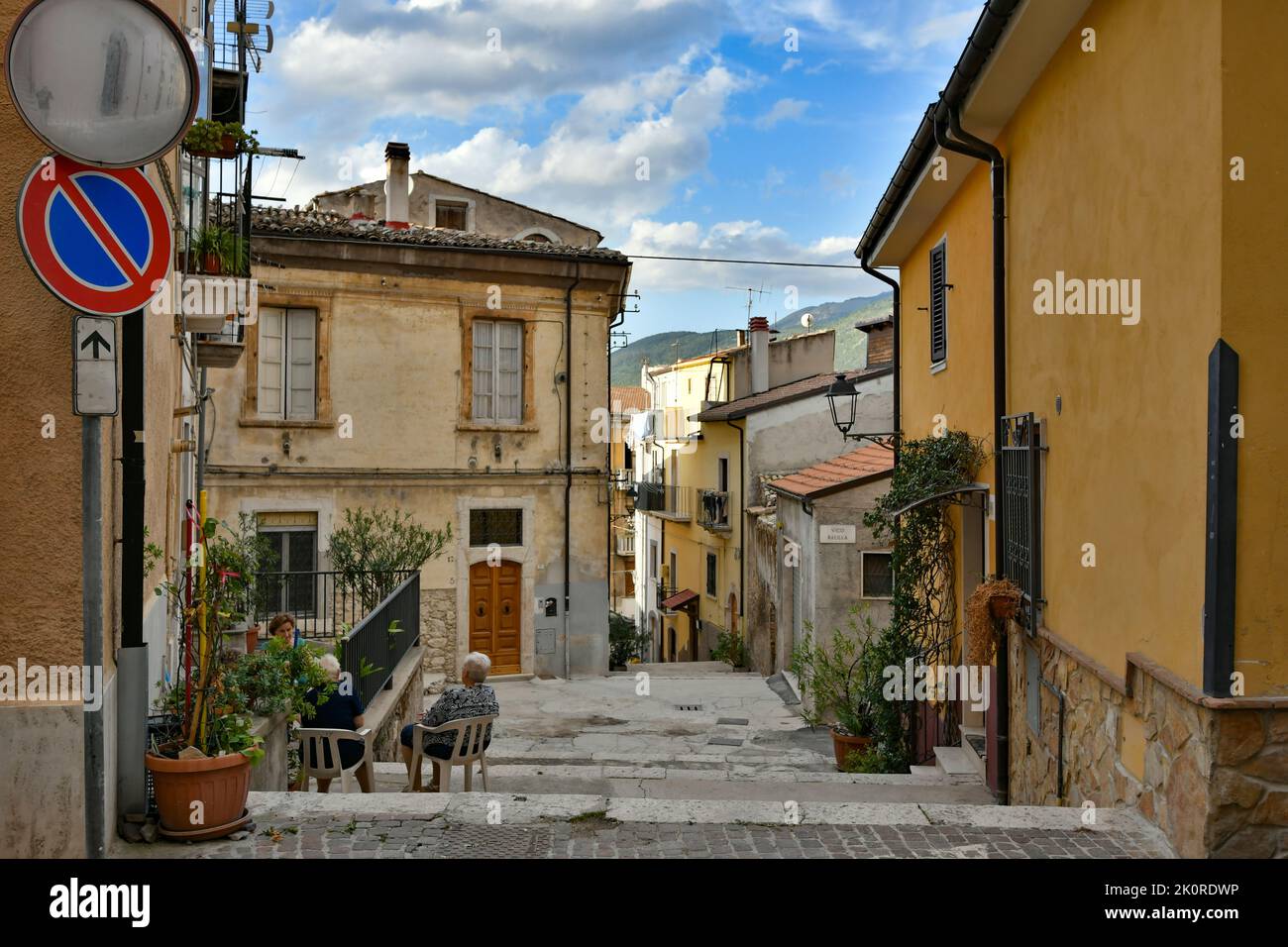 A narrow street between the old stone houses of Pratola Peligna, a