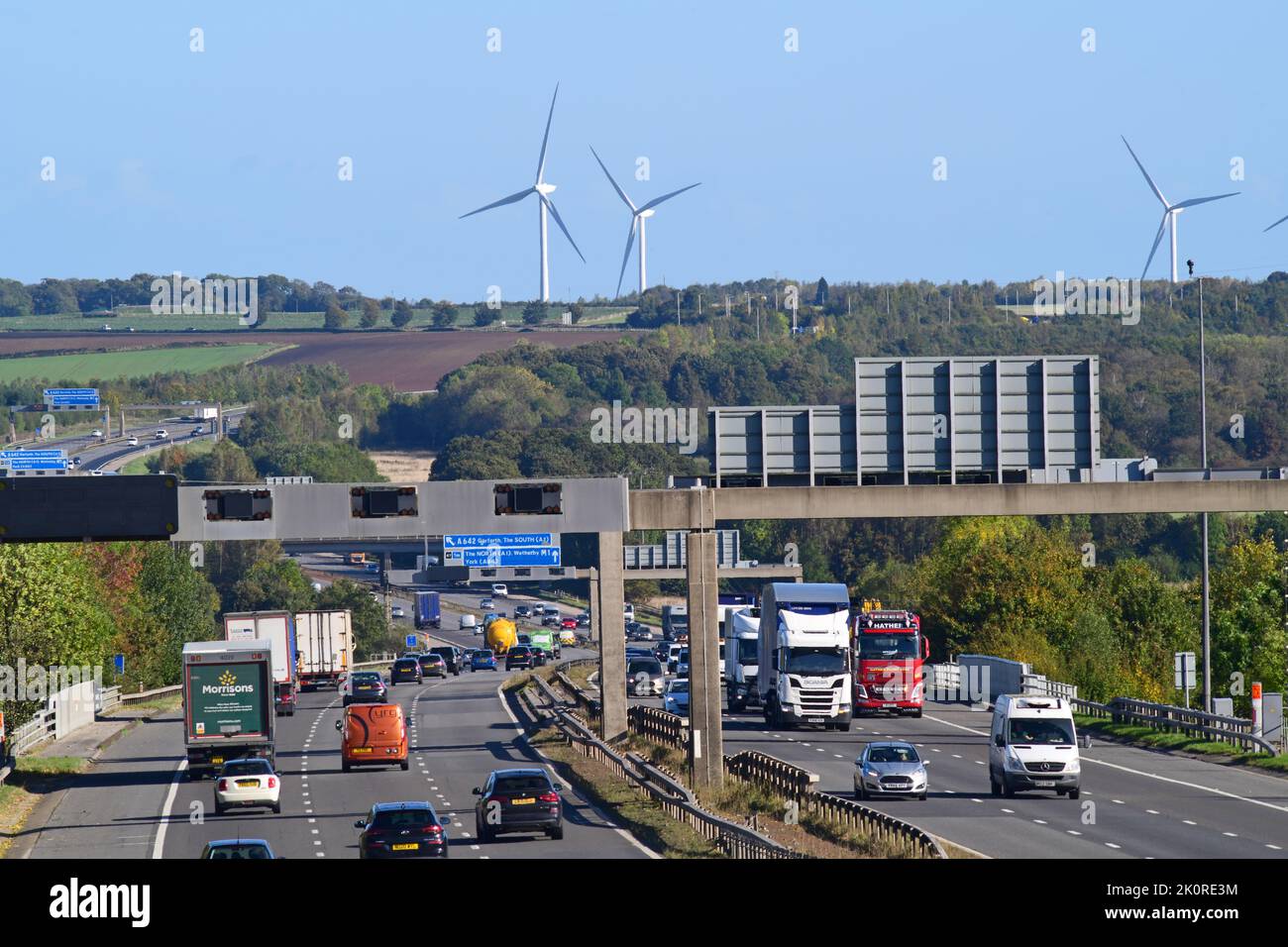 traffic on M1 motorway passing hook moor windfarm leeds united kingdom Stock Photo