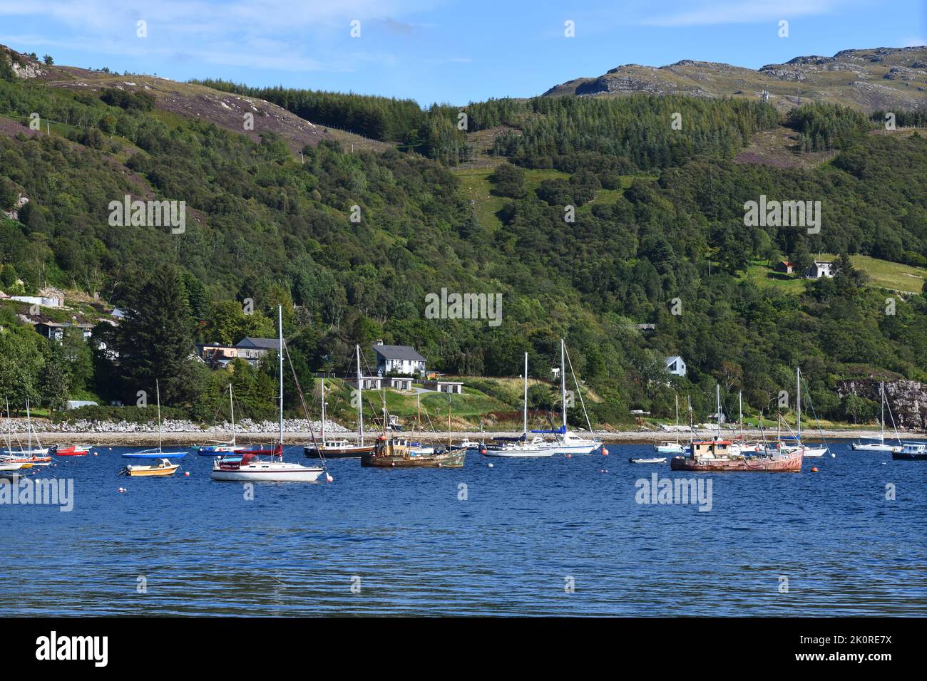 Yachts moored in the bay off Ullapool on Loch Broom, Scotland, UK Stock Photo