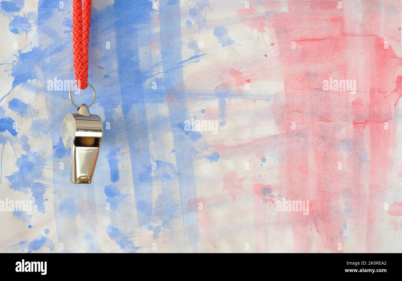 Whistle of soccer referee or trainer on grungy background with french national colours. Great soccer event this year, free copy space Stock Photo