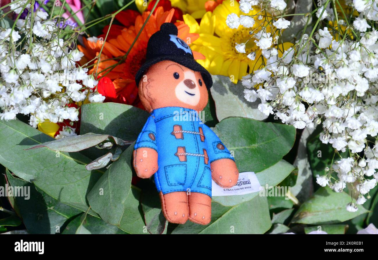 Manchester, UK, 13th September, 2022.  A Paddington Bear tribute left with flowers in St Ann's Square, Manchester, United Kingdom, as a tribute to Her Majesty, Queen Elizabeth II. The Queen died, aged 96, on 8th September, 2022. Manchester City Council has said on its website that the city of Manchester will be observing the official 10-day mourning period and that: 'Residents may wish to lay flowers to mark Her Majesty’s death. You can lay flowers at St Ann's Square'. Credit: Terry Waller/Alamy Live News Stock Photo