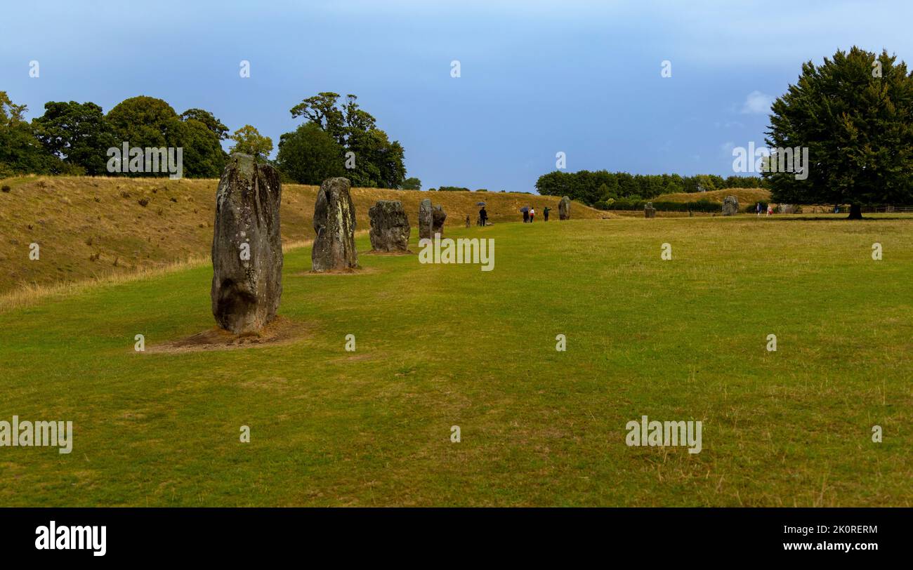 Tourists visiting Avebury stone circle, a Neolithic henge monument, Wiltshire, England, United Kingdom. Stock Photo