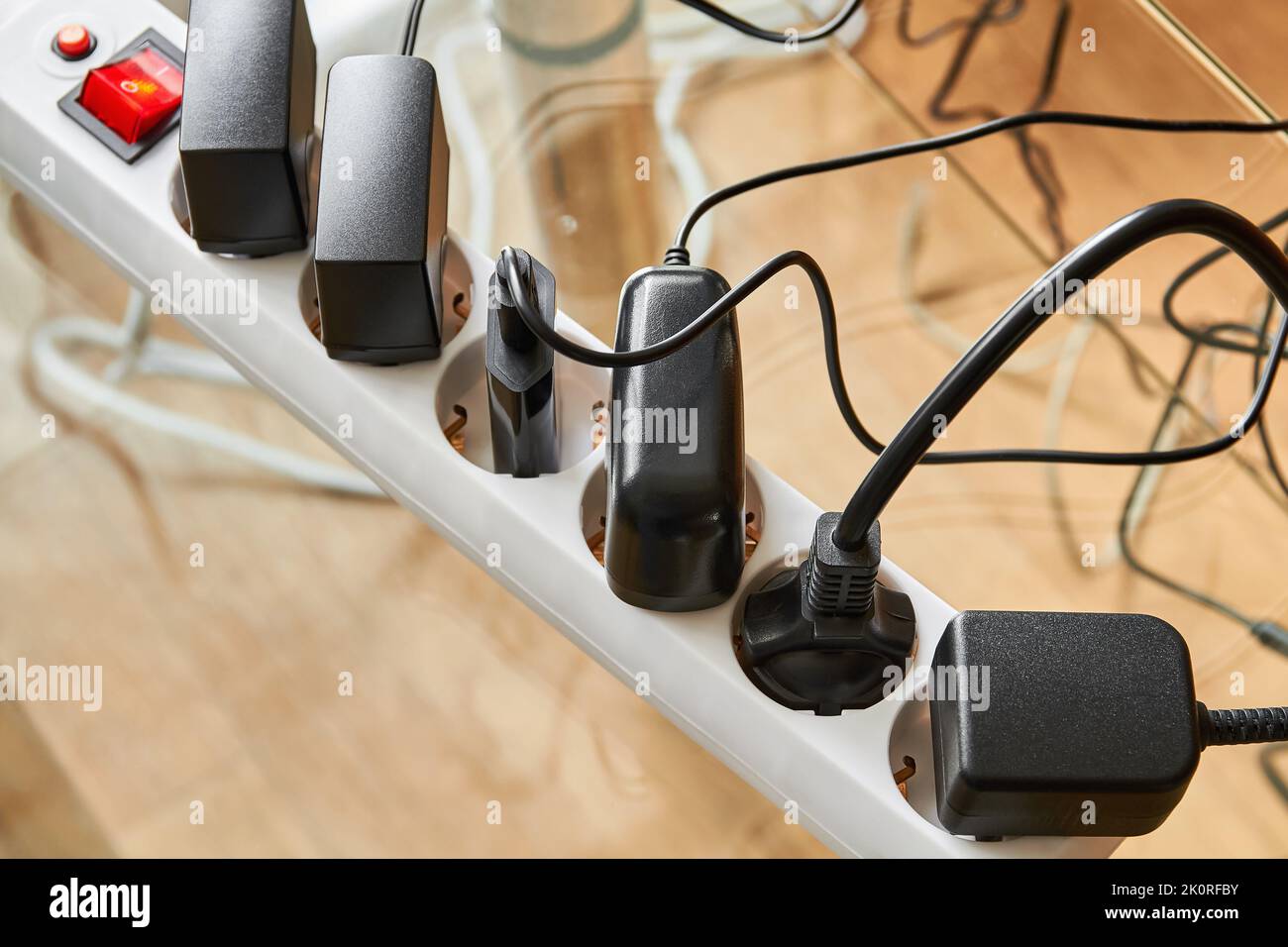 Electrical power strip overloaded with multiple electrical cords
