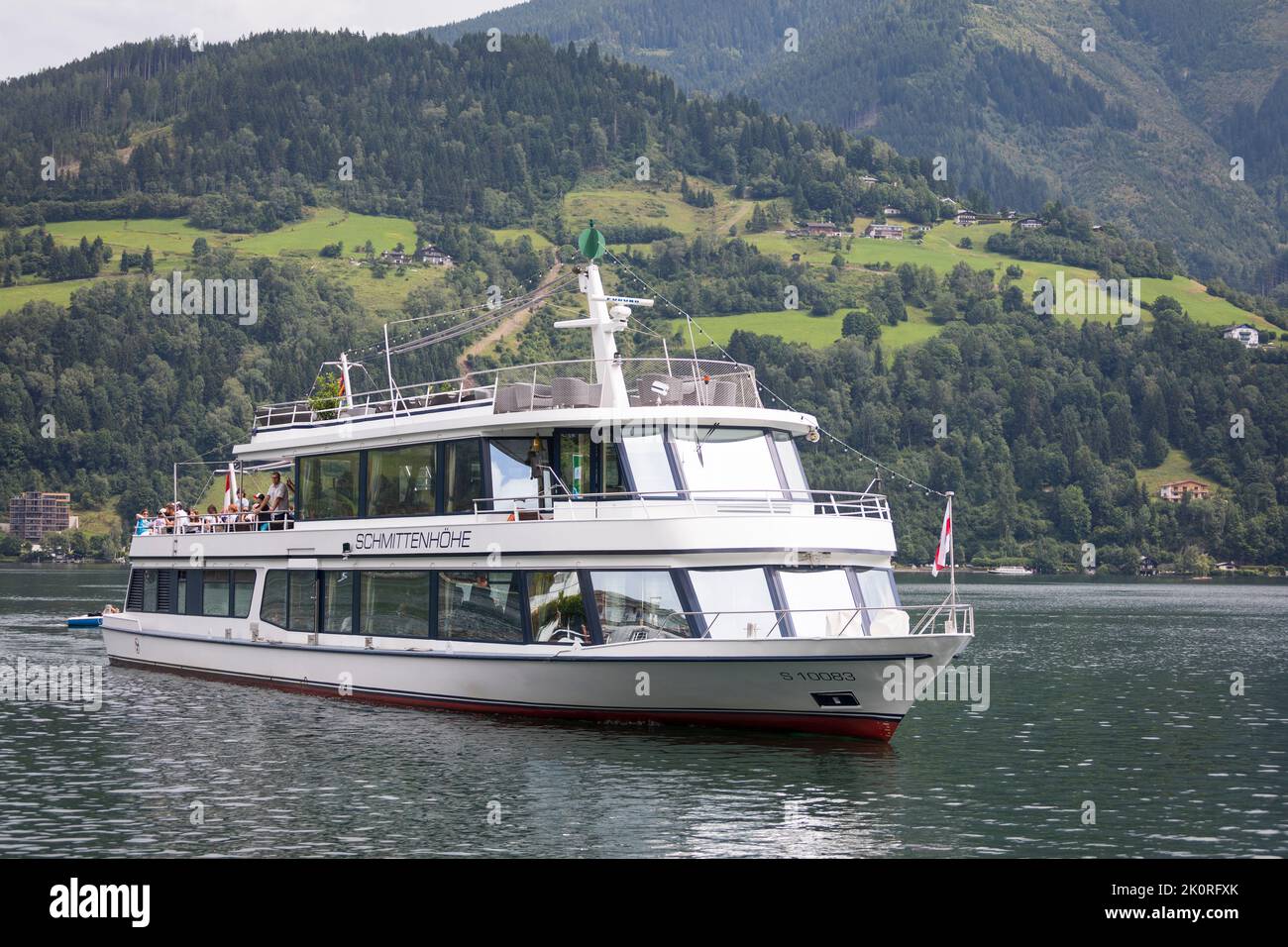 Sightseeing boat with passengers arriving at harbor Zell am See, Austria Stock Photo