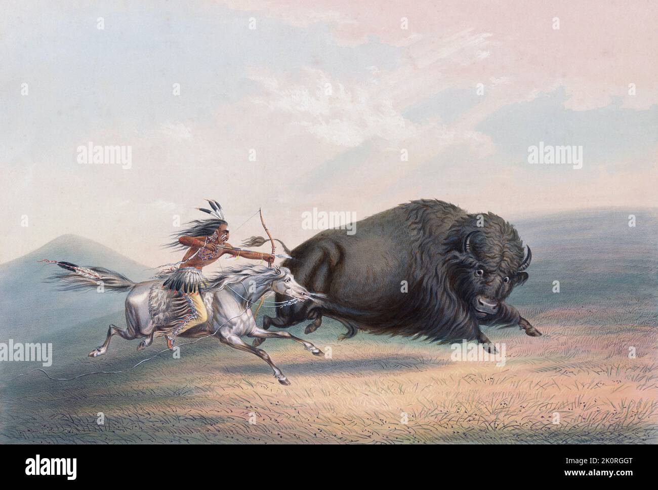Buffalo hunt chase.  A plains Indian on horseback shoots at a buffalo with his bow and arrow. American bison (B. bison). From Catlin's North American Indian Portfolio, published in London 1844 by the artist, American adventurer George Catlin, 1796 - 1872.  During many journeys Catlin recorded with pen and brush the customs and life-styles of Native American tribes. Stock Photo