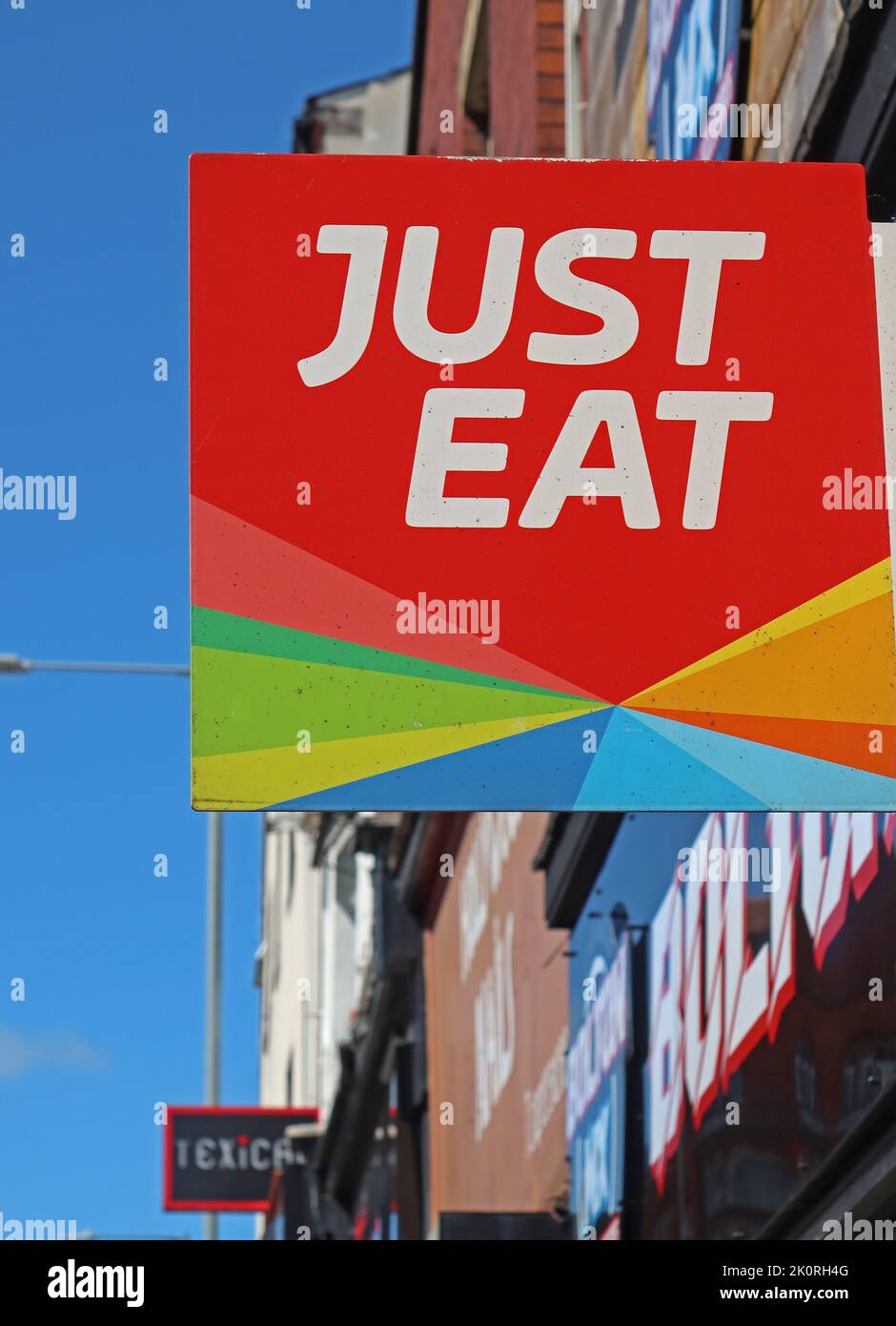 Just Eat sign, Indian takeaway, Lovely Lane, Warrington, Cheshire, England, UK, WA5 1QG Stock Photo