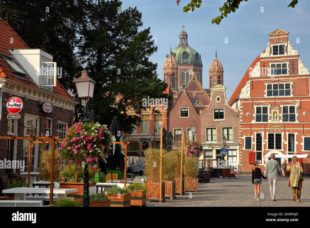 HOORN, NETHERLANDS - SEPTEMBER 4, 2022: The colorful facades of historic houses located along Kerkstraat street in the city center of Hoorn Stock Photo