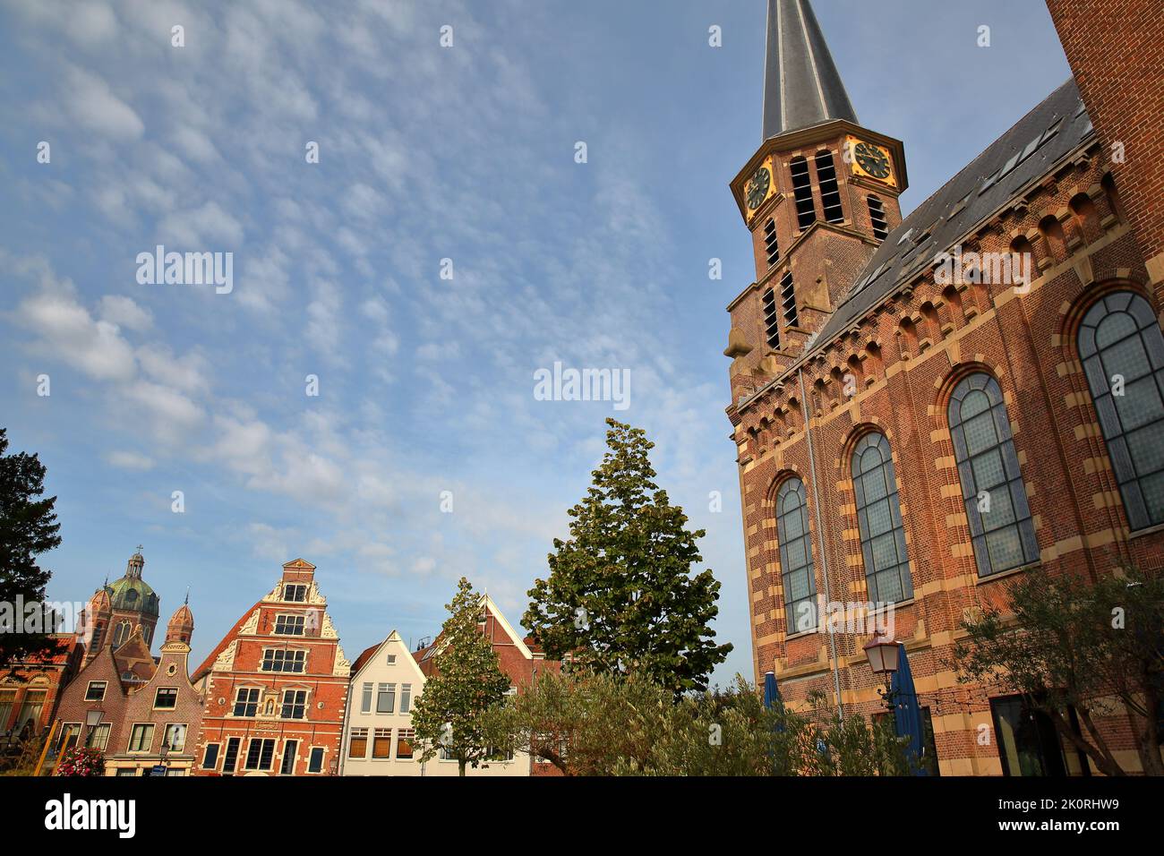 The Grote kerk church (on the right) and historic houses (Boterhal and the Dome of Koepelkerk church) in Hoorn, West Friesland, Netherlands Stock Photo