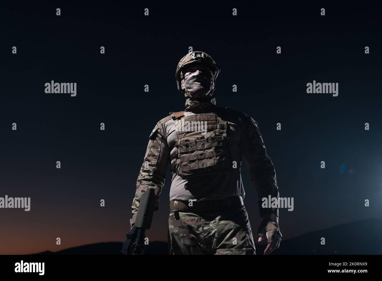 Army soldier in Combat Uniforms with an assault rifle, plate carrier ...