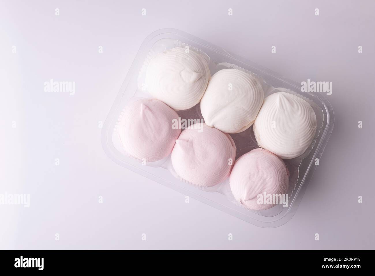 pink and white marshmallows packed on a white background. Stock Photo