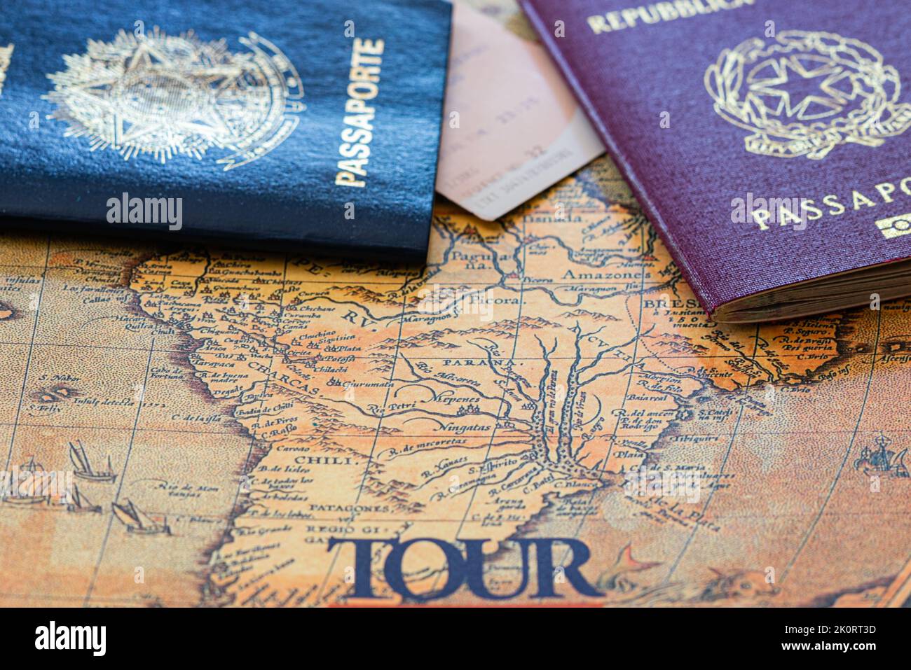 Brazilian and Italian passports - Brazilian And Italian Passports On An Ancient Map Of South America Ready For The Tour Holidays Concepthorizontal View 2K0RT3D