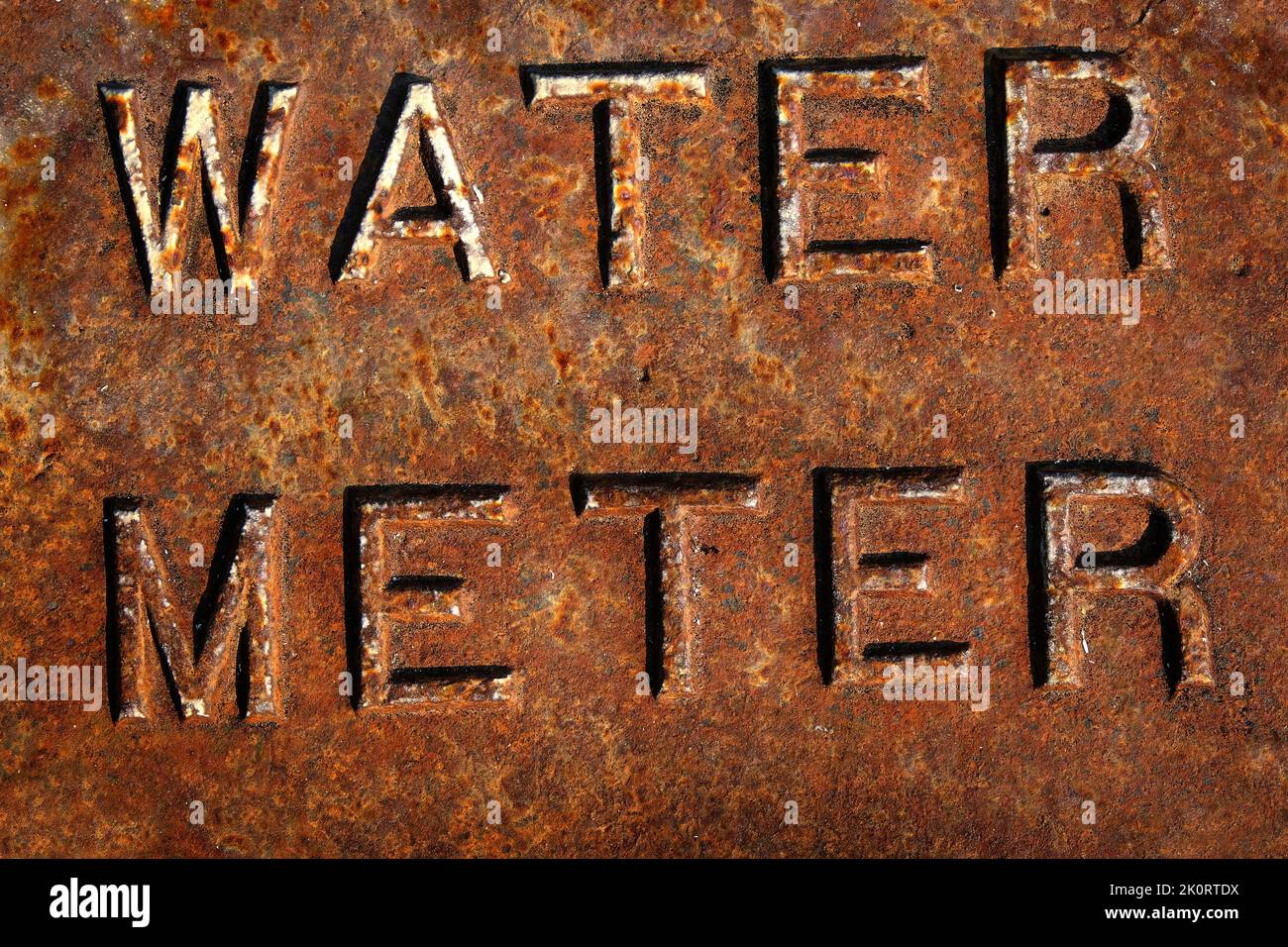Water meter cover rusted rusty access to water system Stock Photo Alamy