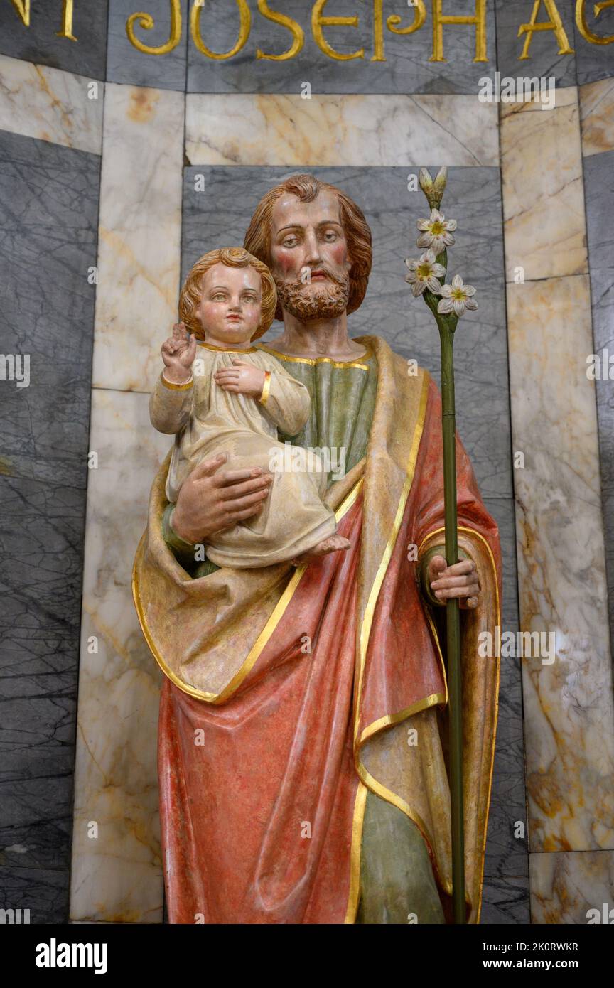 Saint Joseph with Infant Jesus. The Church of Saints Cosmas & Damian in Clervaux, Luxembourg. Stock Photo