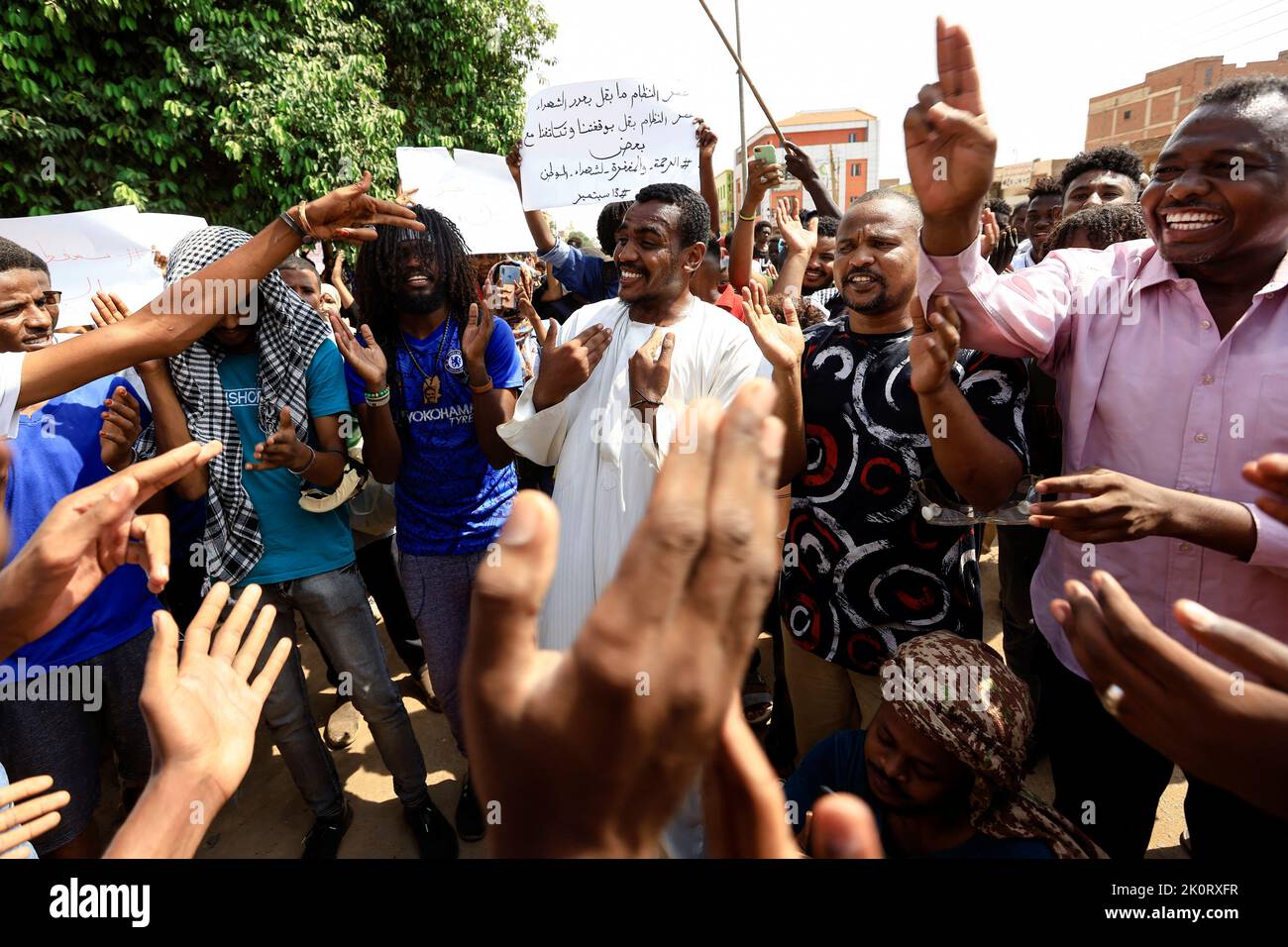 Protesters react as they take part in a rally against the military rule following the last coup, in Khartoum, Sudan September 13, 2022. REUTERS/Mohamed Nureldin Abdallah Stock Photo