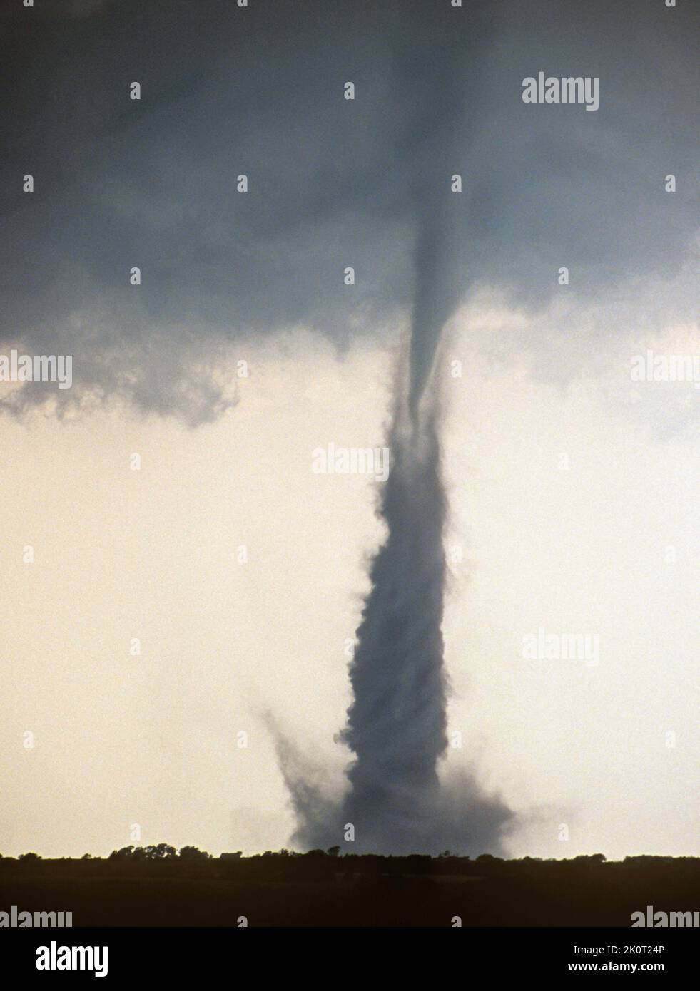 A tornado spins over farmland in Nebraska, USA Stock Photo