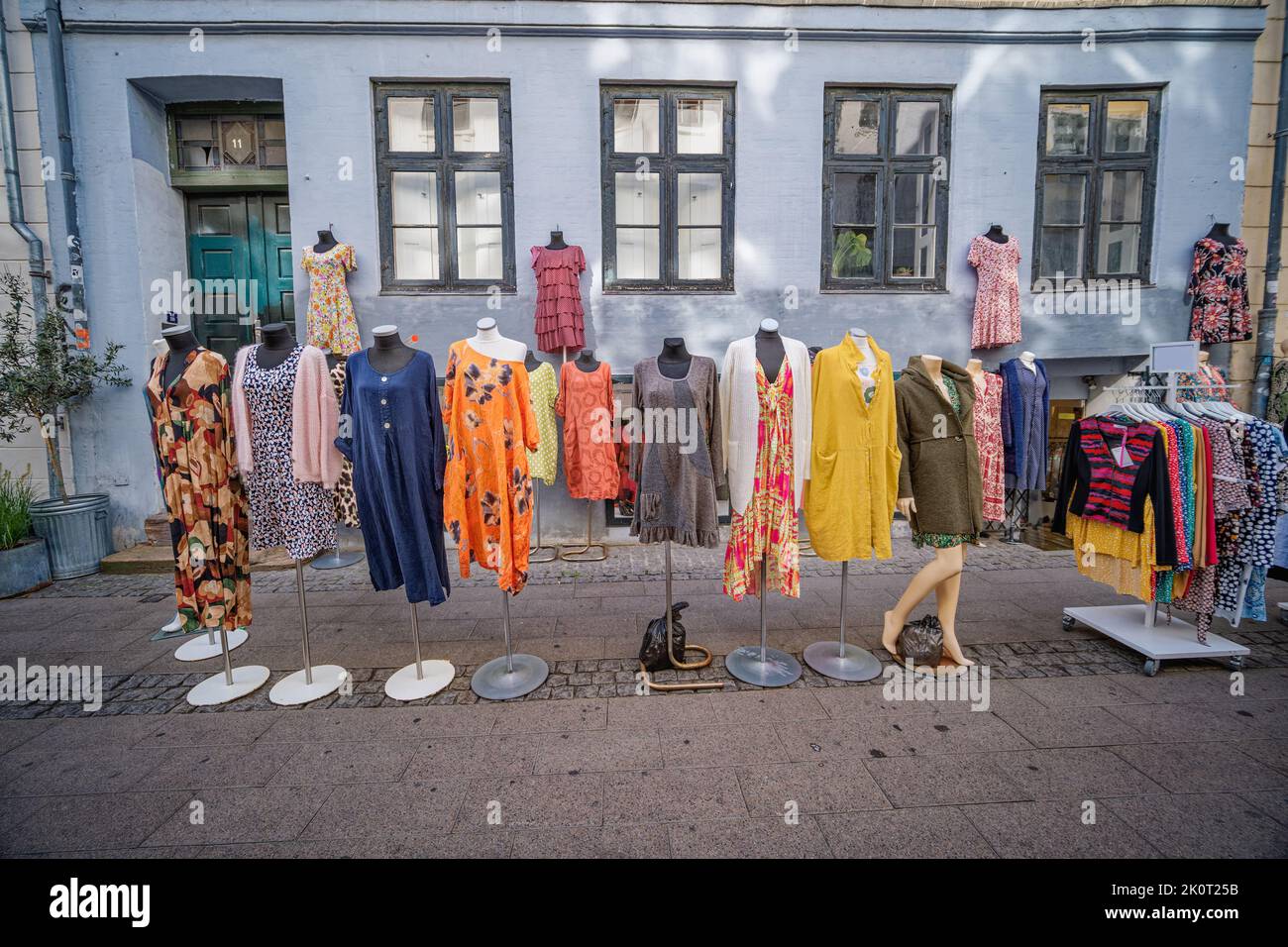 Clothes for sale in the small streets of central Copenhagen, Denmark Stock Photo