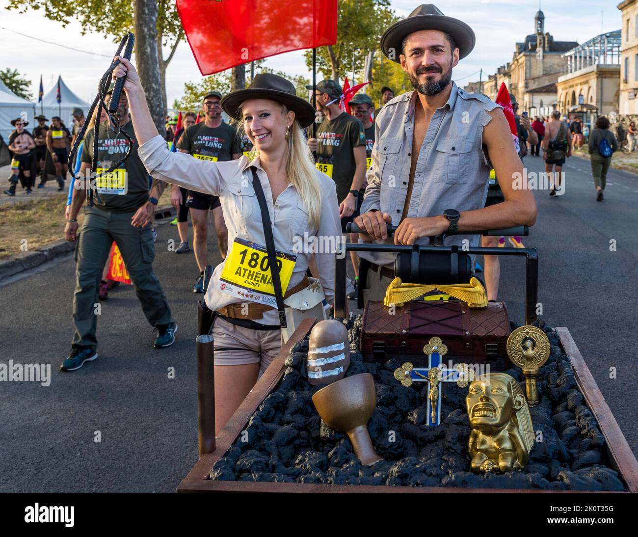 Indiana Jones as Raiders of the Lost Ark. Before the start of the Marathon des Chateaux du Medoc, there is a costume parade. The loudspeakers play famous film music and the atmosphere among the participants is excellent. Many run in groups or as a pair and again and again the motto 'film' is taken up Stock Photo