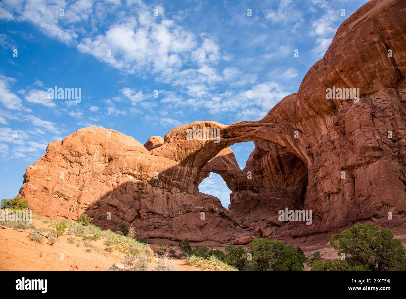 Double Arch, an Entrada sandstone arch in the Windows Section of Arches National Park & part of Elephant Butte. Moab, Utah. Stock Photo