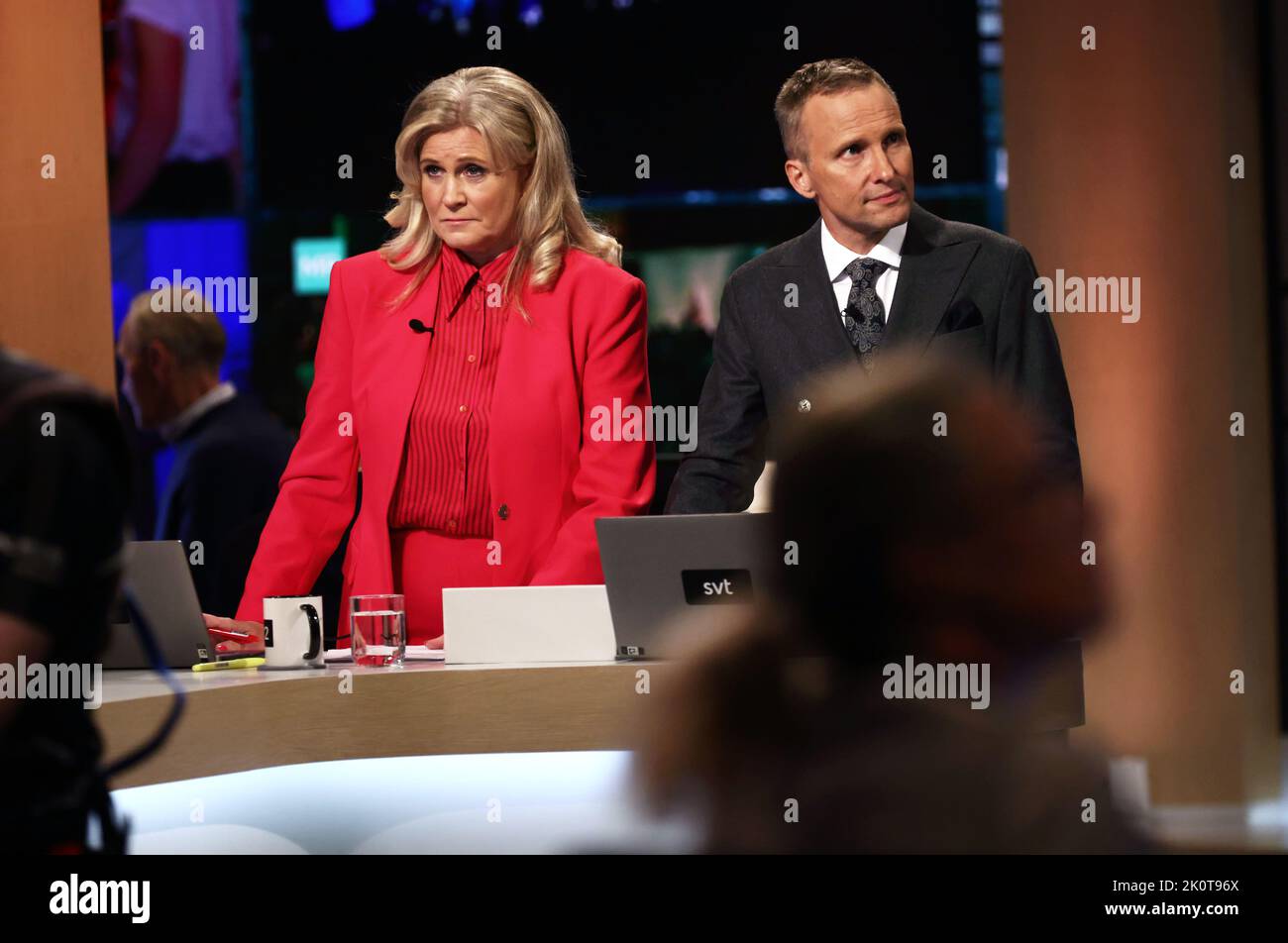 The Swedish parliamentary elections, election day, during Sunday in Stockholm, Sweden. In the picture: Sveriges Television's broadcast during election evening. In the picture: Camilla Kvartoft and Anders Holmberg. Stock Photo