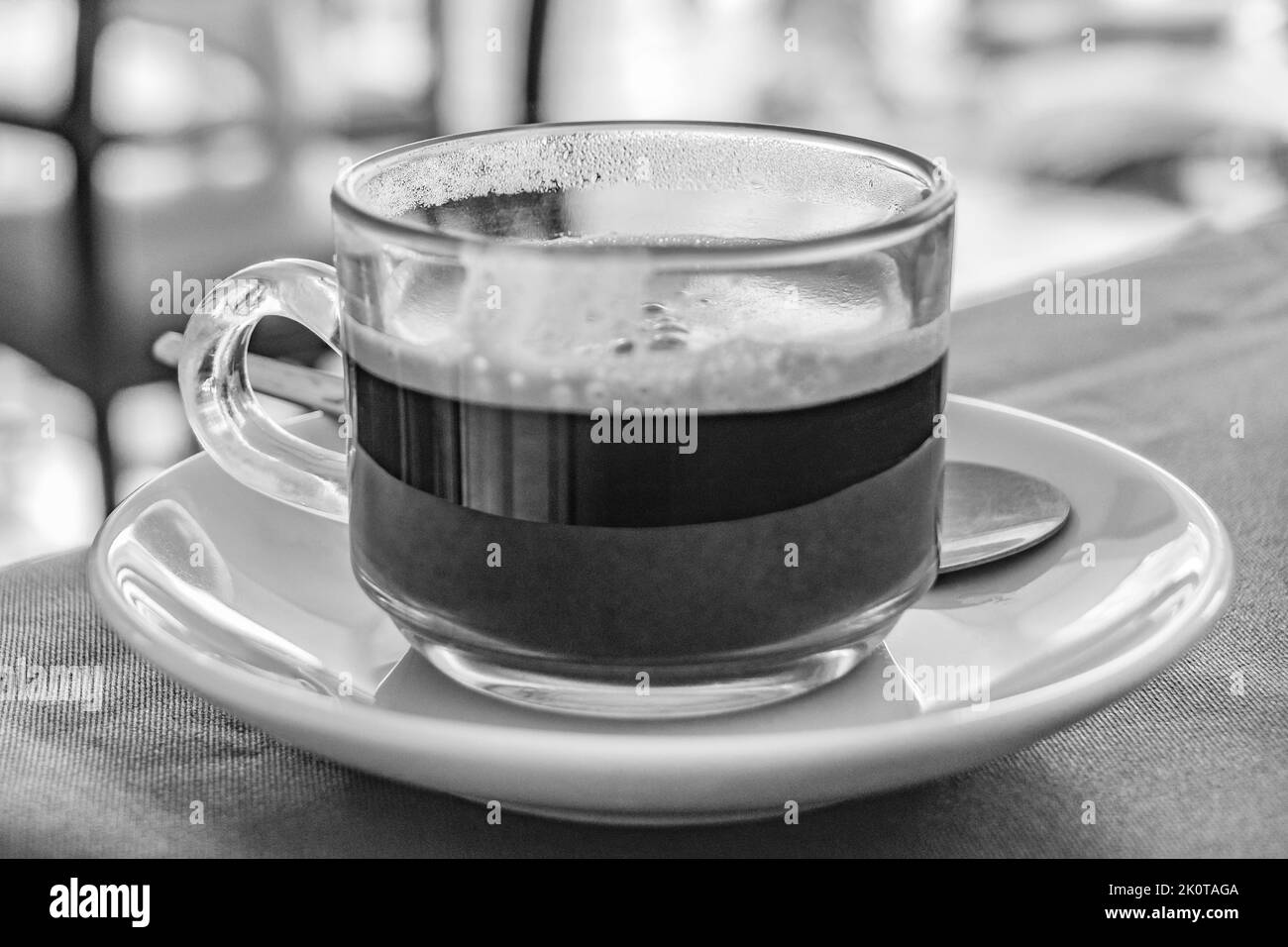 Glass Cup of black coffee in a restaurant at Nai Thon Naithon Beach Thalang Phuket Thailand. Stock Photo