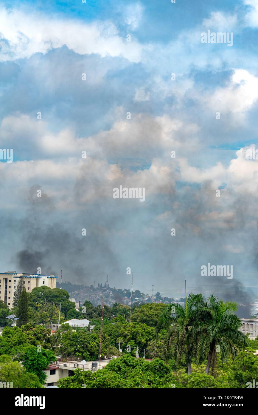 Civil unrest in Port-au-Prince, Haiti. The population is protesting against fuel shortage and inflation by paralyzing the city with burning tires Stock Photo