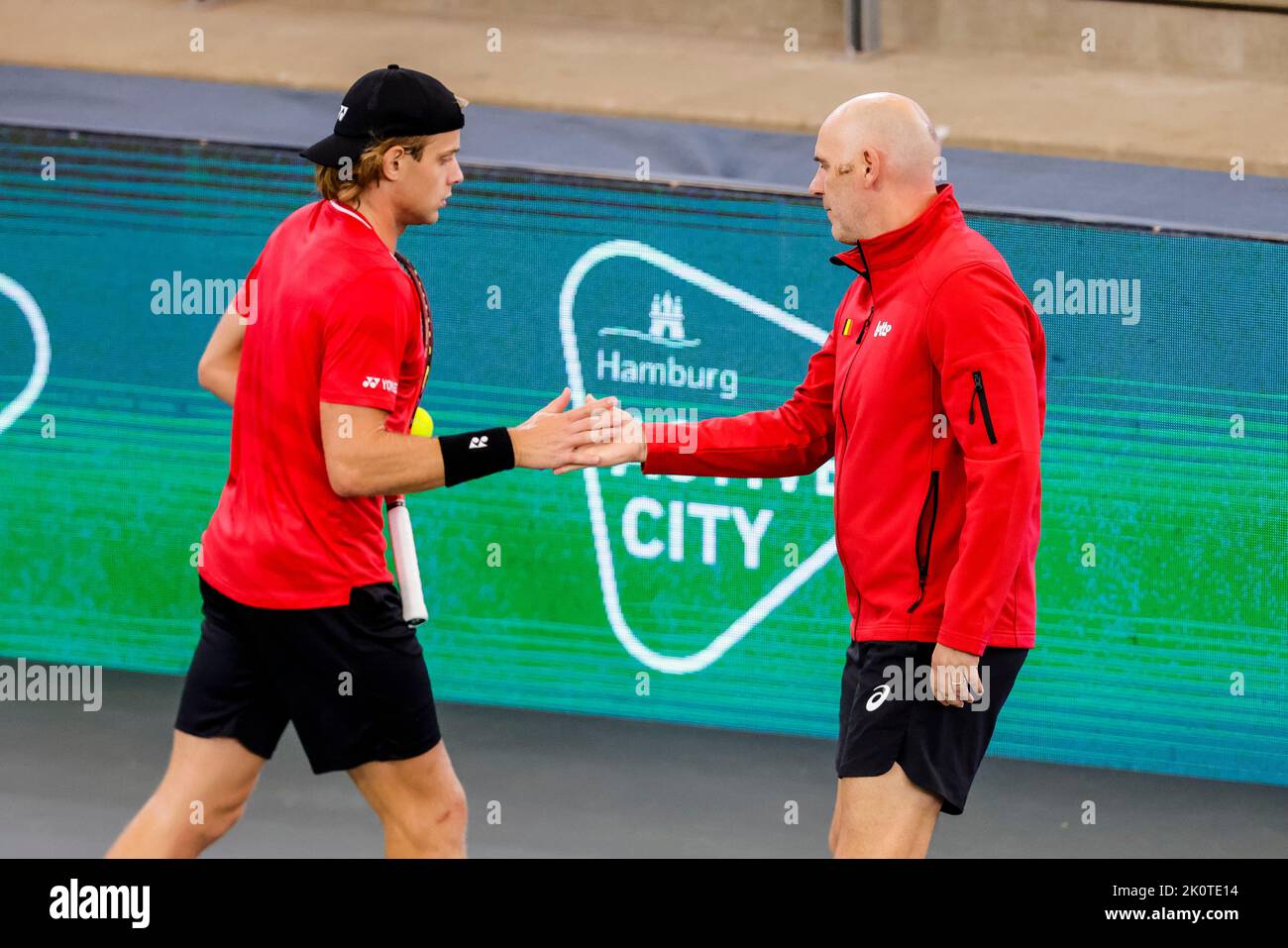 Hamburg, Germany, 13th Sep, 2022. Belgian Zizou Bergs (L) shakes hands with Johan Van Herck during the group stage match between Belgium and Australia at the 2022 Davis Cup finals in Hamburg, Germany. Photo credit: Frank Molter/Alamy Live news Stock Photo