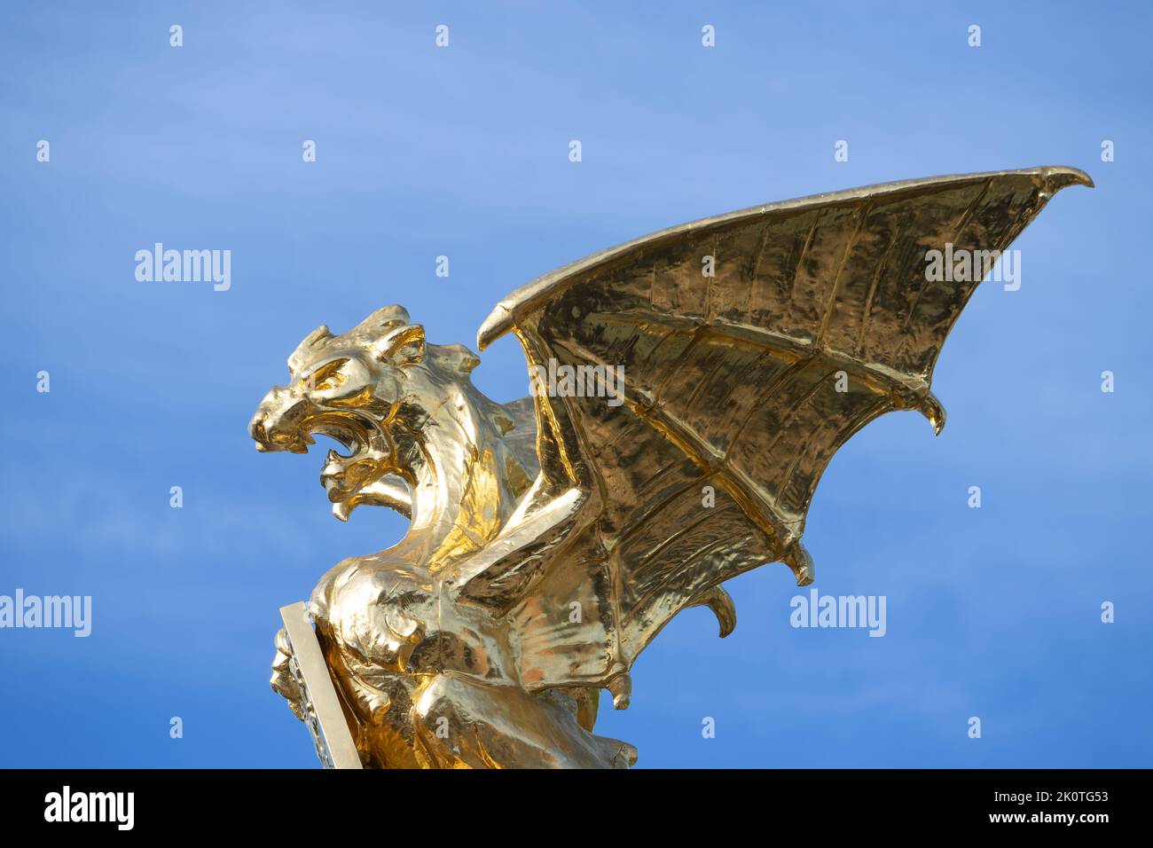A gilded dragon on top of a fountain in Den Bosch. It was placed in 1903 on the crossing 'Stationsweg' and 'Koninginnelaan'. Stock Photo