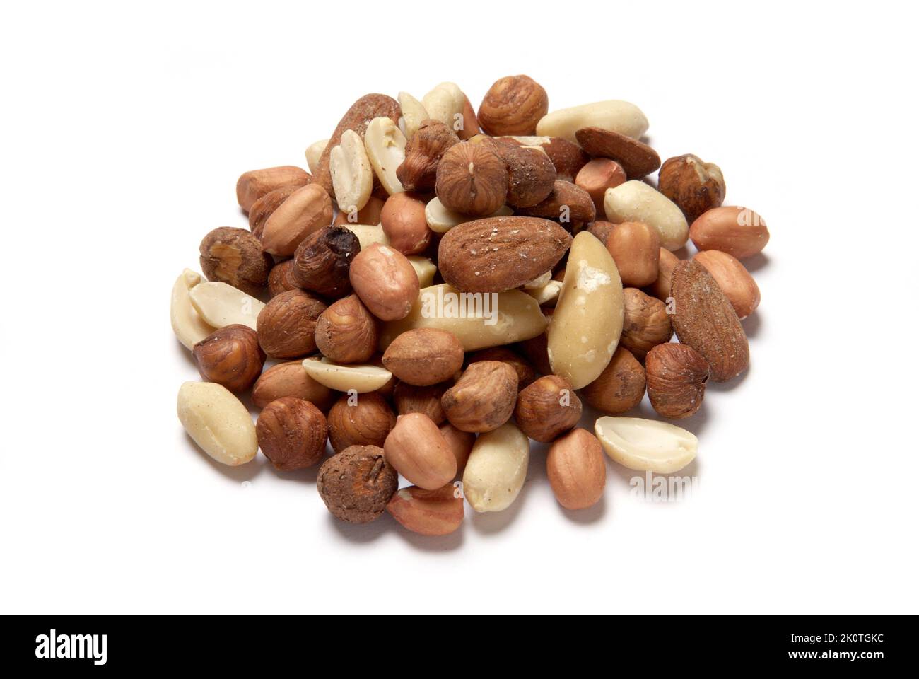 A pile of organic mixed nuts on white background cut out Stock Photo