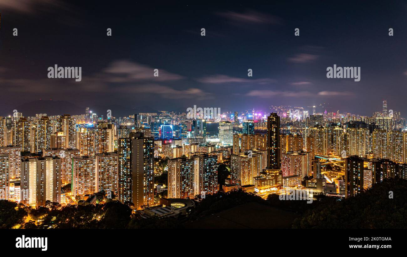 An aerial view of an illuminated city with modern tall buildings at ...