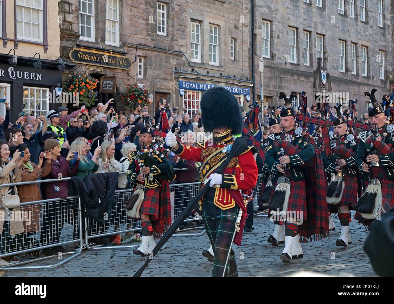 Royal Mile, Edinburgh, Scotland, UK. Royal Highland Fusiliers pipes and drums band march down Royal Mile as crowds gather for Coffin of Her Majesty Queen Elizabeth II departing St Giles Cathedral.13th September 2022. Credit: Arch White/alamy live news. Stock Photo