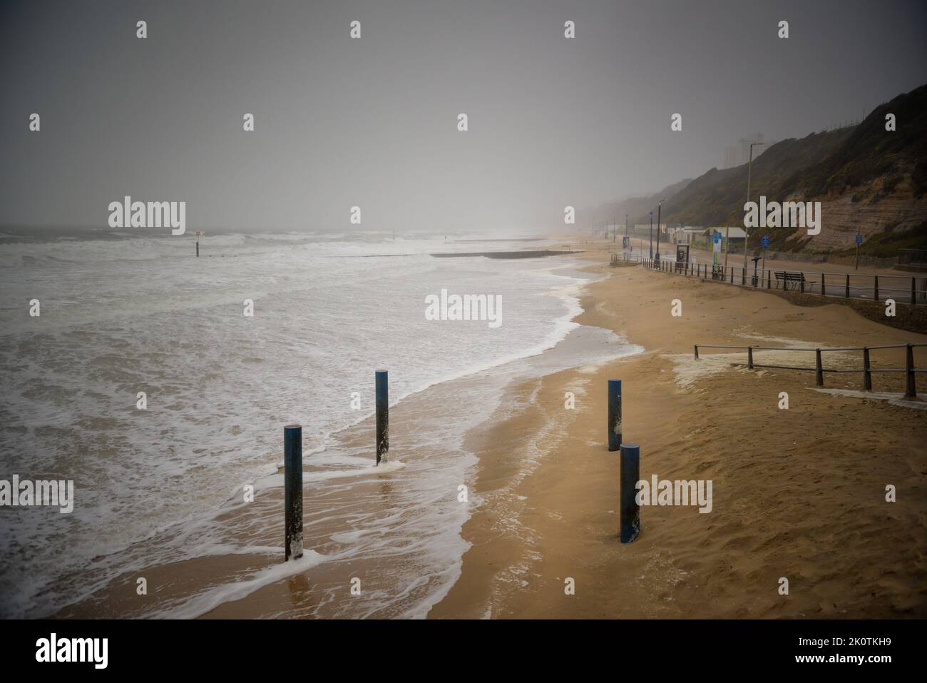 Moody, stormy coastal scene with rough sea, wind and rain Stock Photo