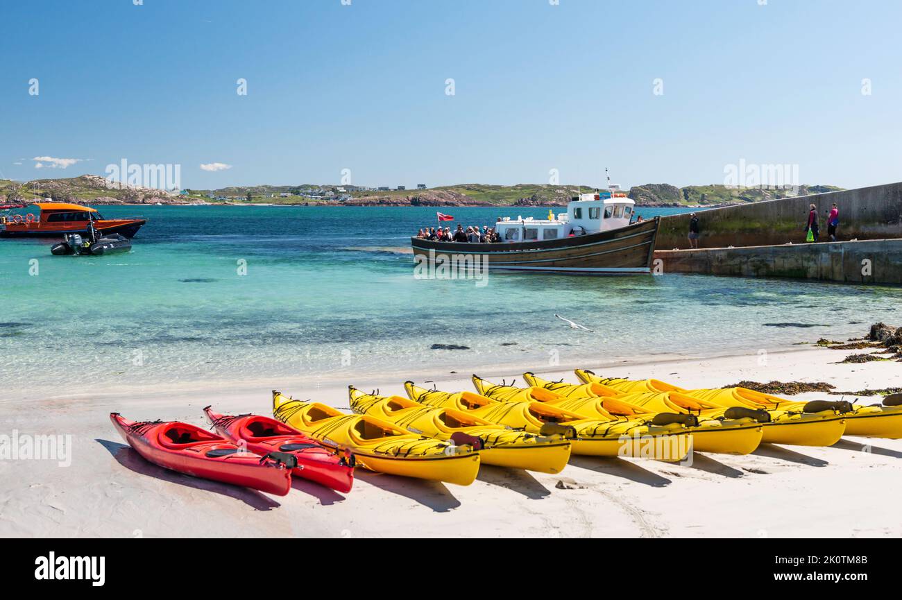 Kayaks on White Sand Beach Baile Mòr, Iona, Scotland. Stock Photo