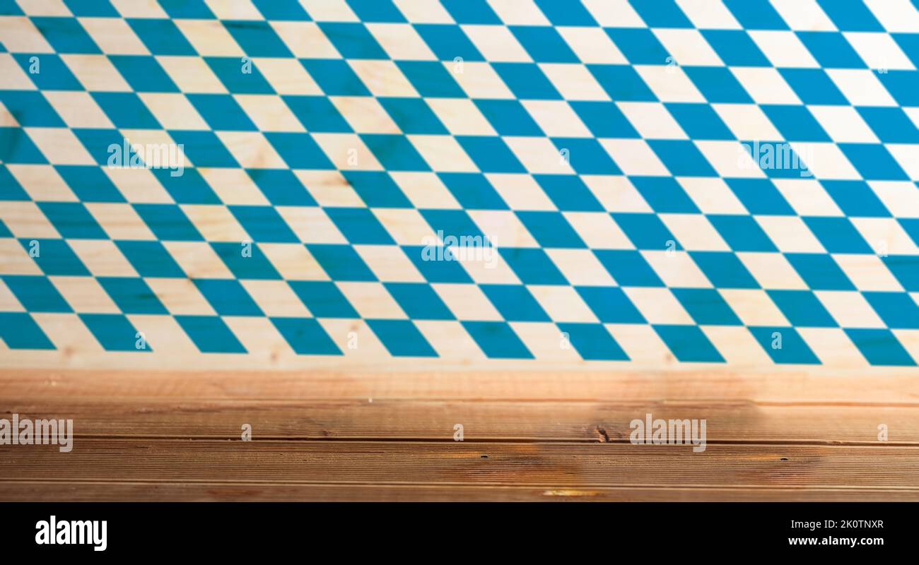 Oktoberfest template. Empty bar counter on Bavarian flag background. Traditional Beer festival, Munich Germany Stock Photo