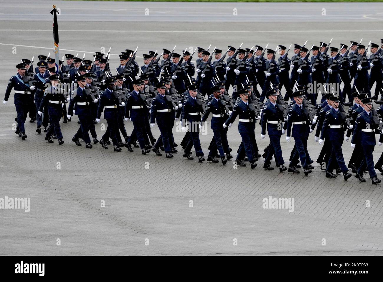 The bearer party from the Queen's Colour Squadron (63 Squadron RAF Regiment) march into position as they await the coffin of Queen Elizabeth II to arrive at RAF Northolt, west London, from where it will be taken to Buckingham Palace, London, to lie at rest overnight in the Bow Room. Picture date: Tuesday September 13, 2022. Stock Photo