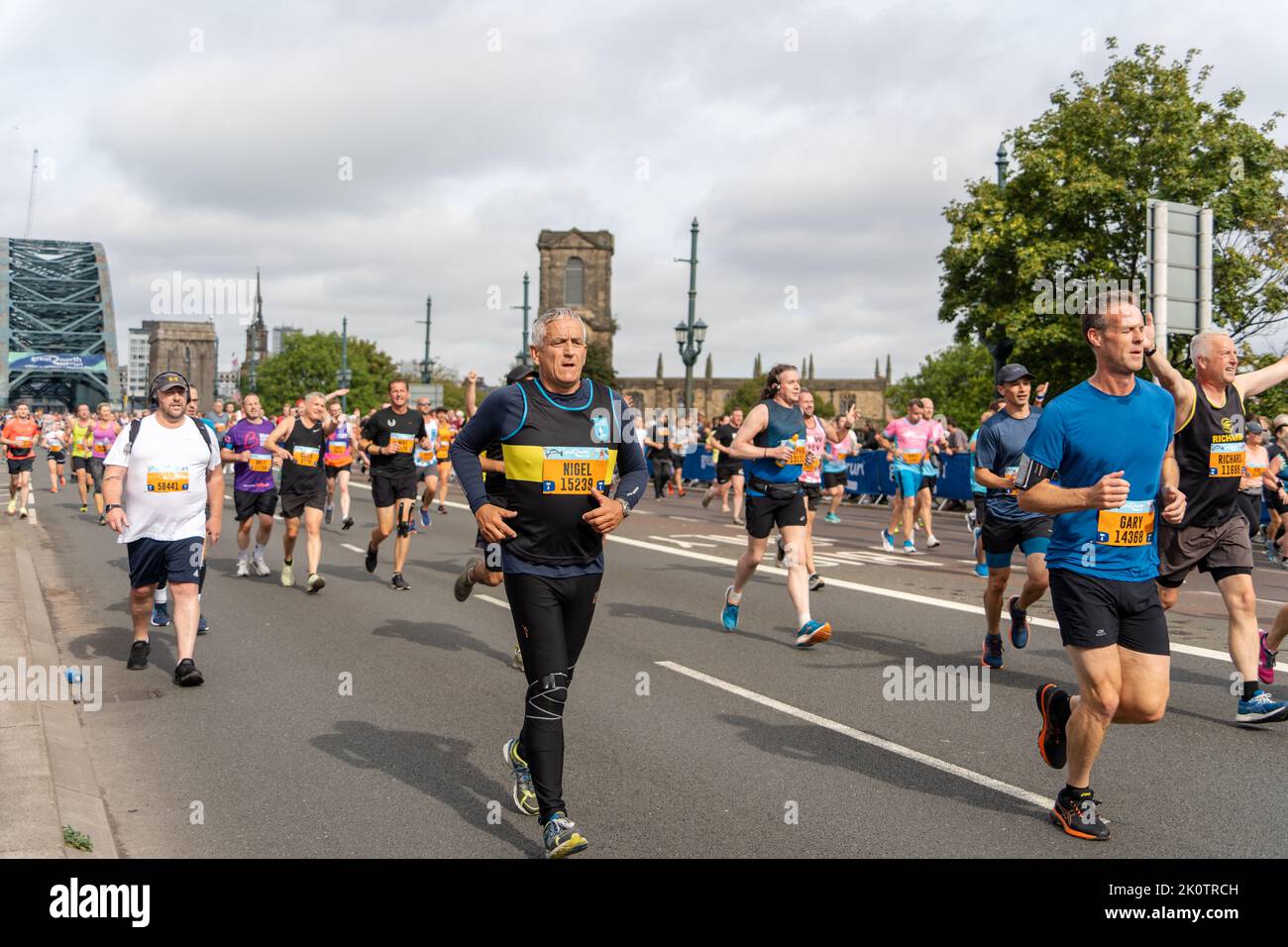 Participants, Great North Run 2022 half marathon, in Gateshead, just after crossing over the Tyne Bridge from Newcastle upon Tyne, UK Stock Photo